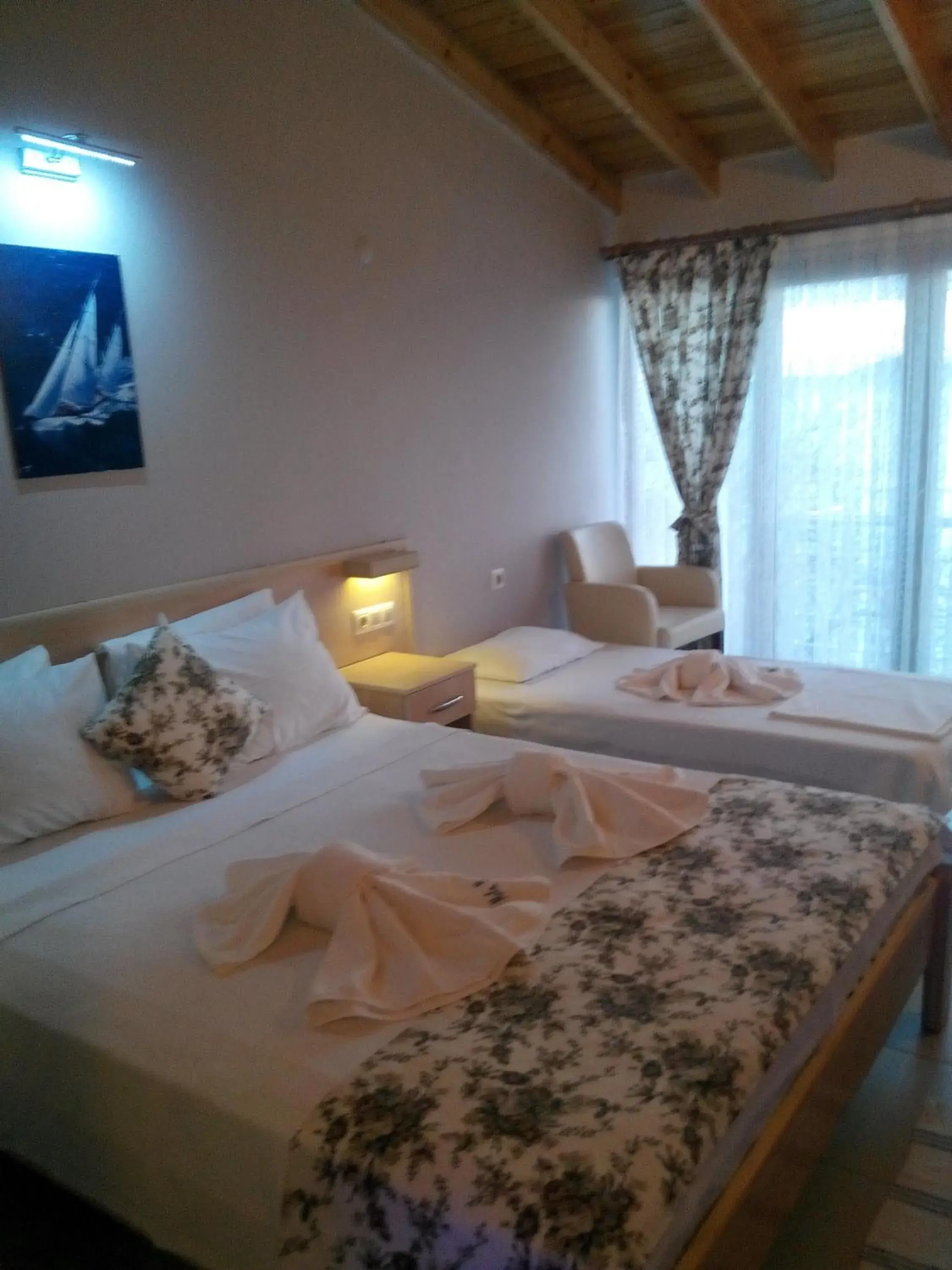 Deluxe Triple Room in Mola Hotel Deluxe Triple Room in Mola Hotel