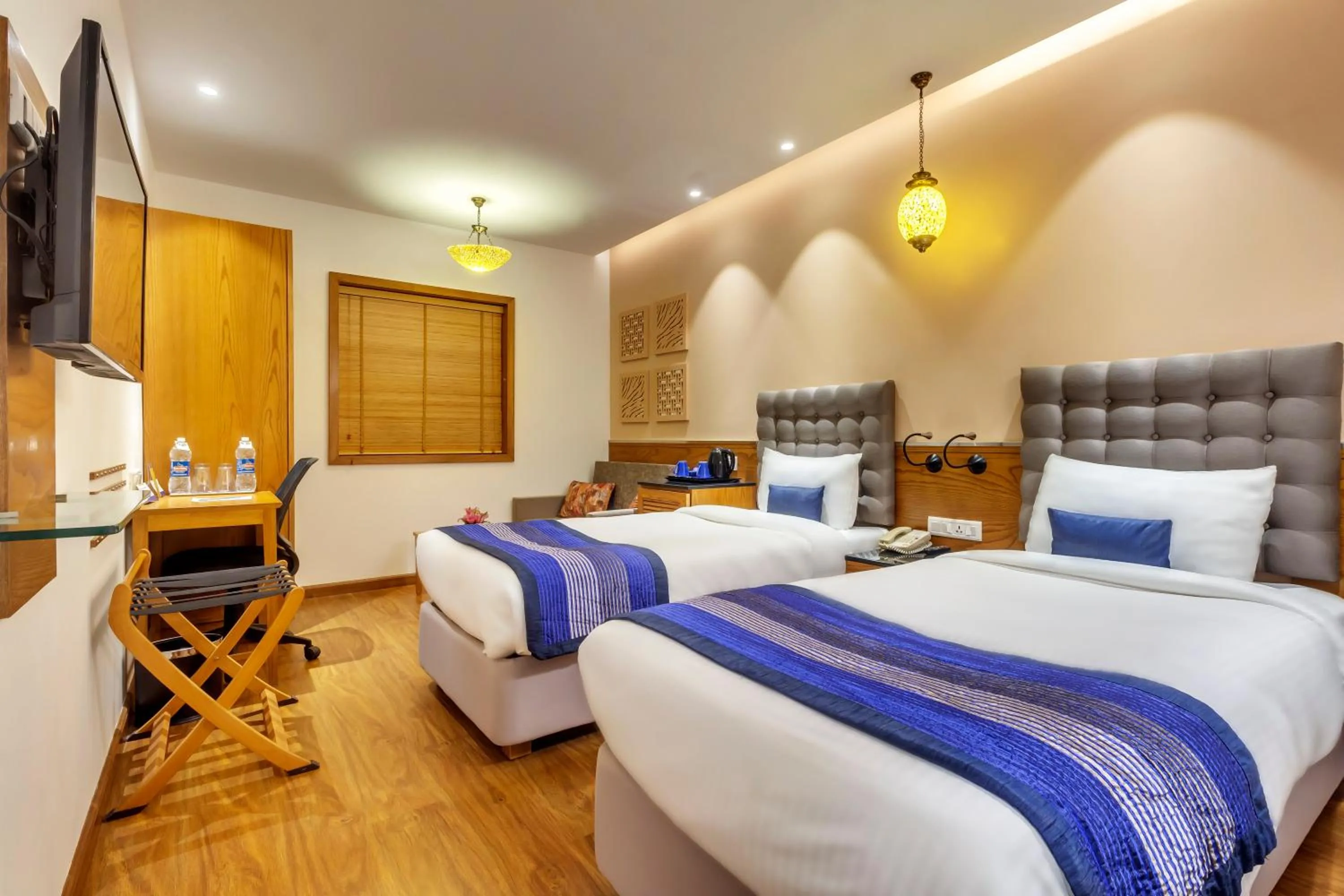 Photo of the whole room, Bed in Golden Tulip New Delhi - Hari Nagar