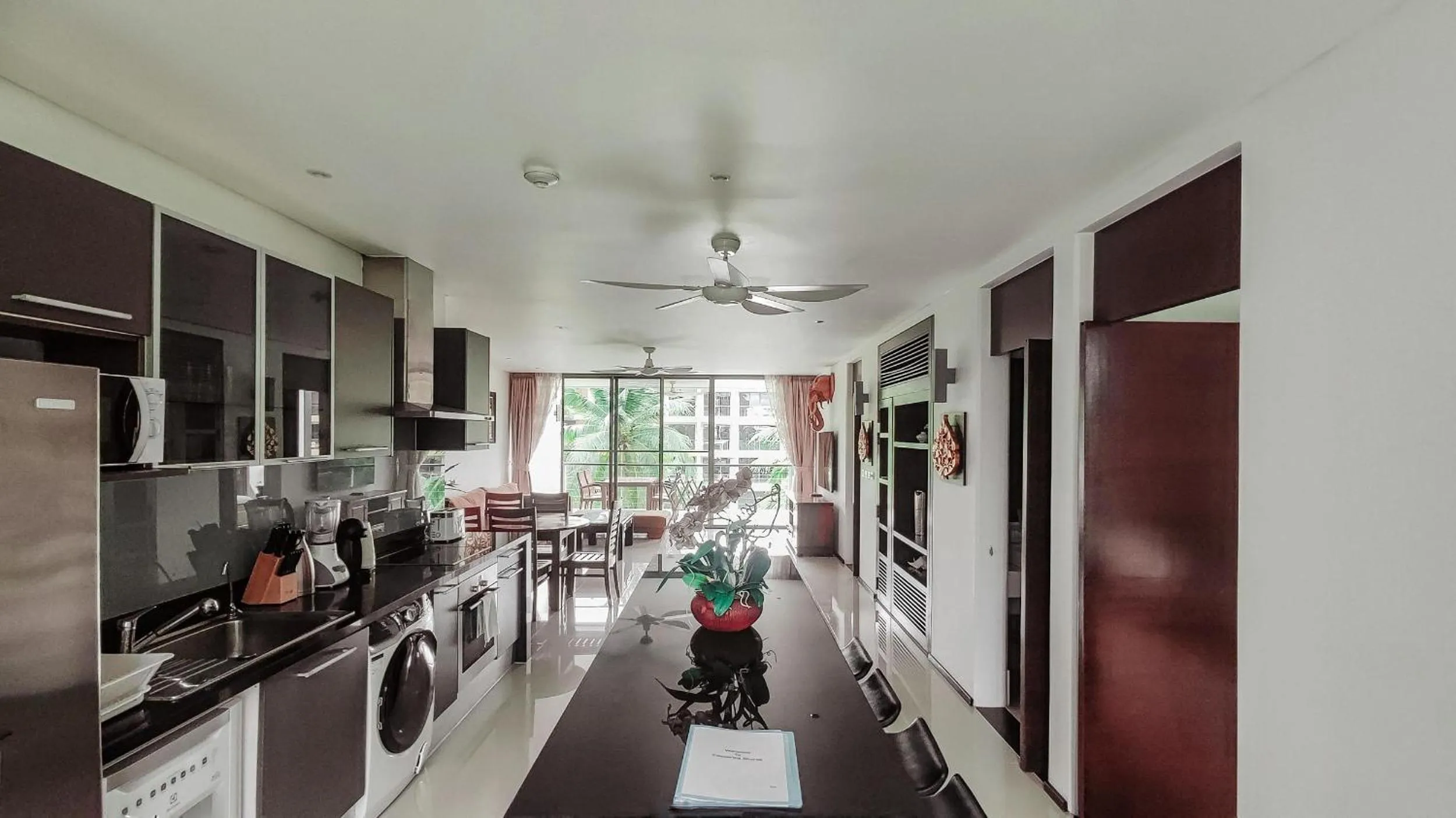 Kitchen or kitchenette in Casuarina Shores Apartment - SHA Plus