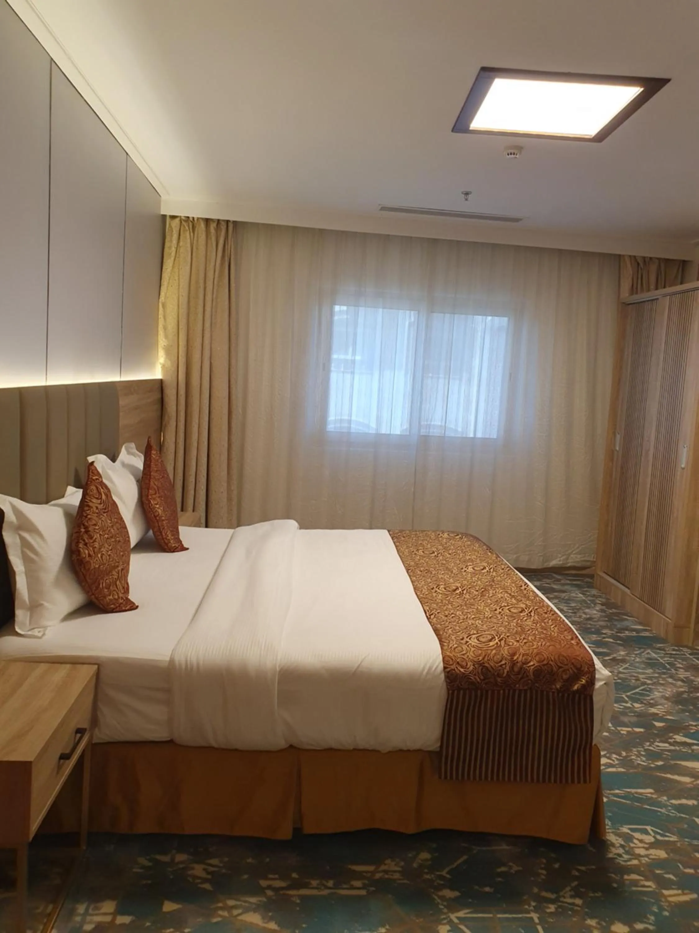 Bed in Sadeem Al Fajr Hotel Suites