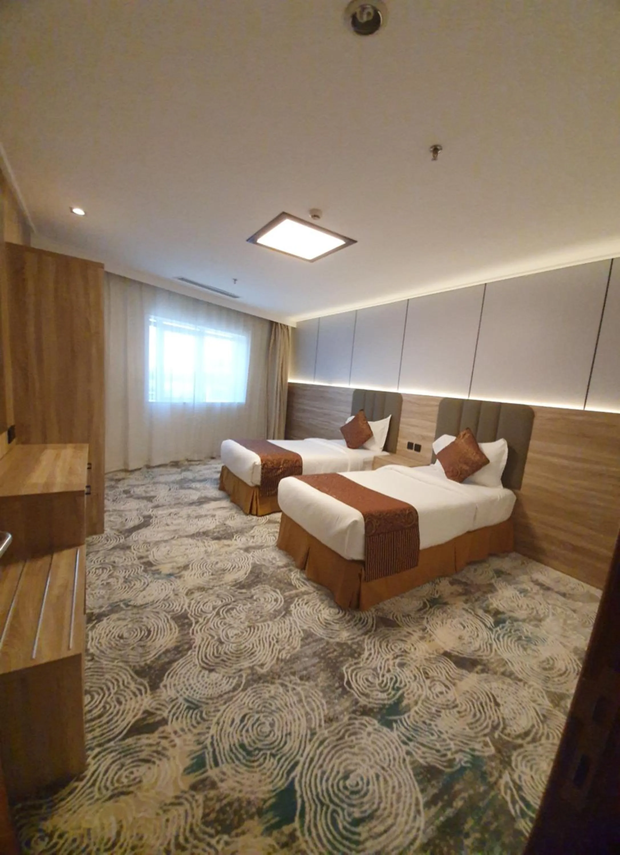 Bed in Sadeem Al Fajr Hotel Suites