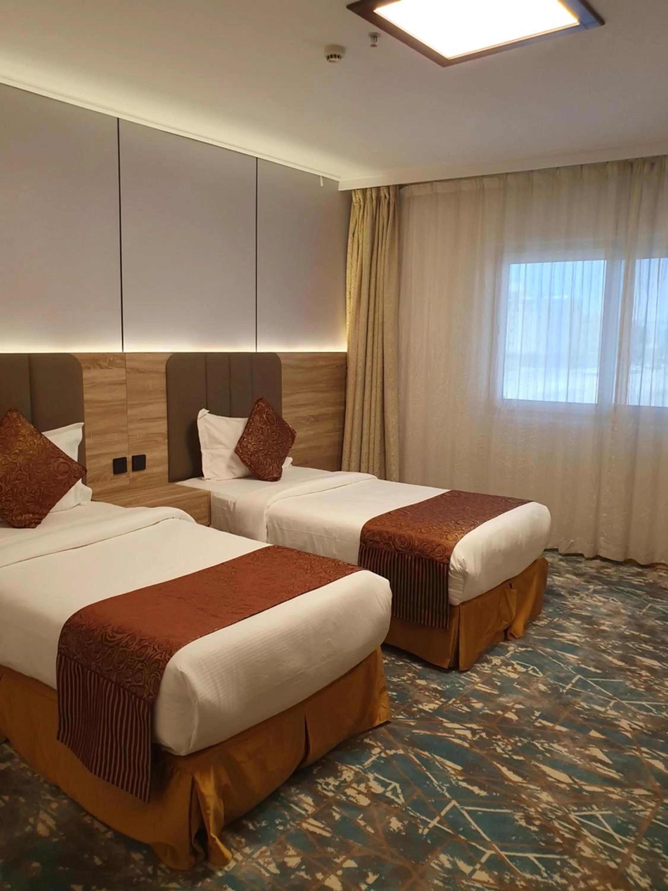 Bed in Sadeem Al Fajr Hotel Suites