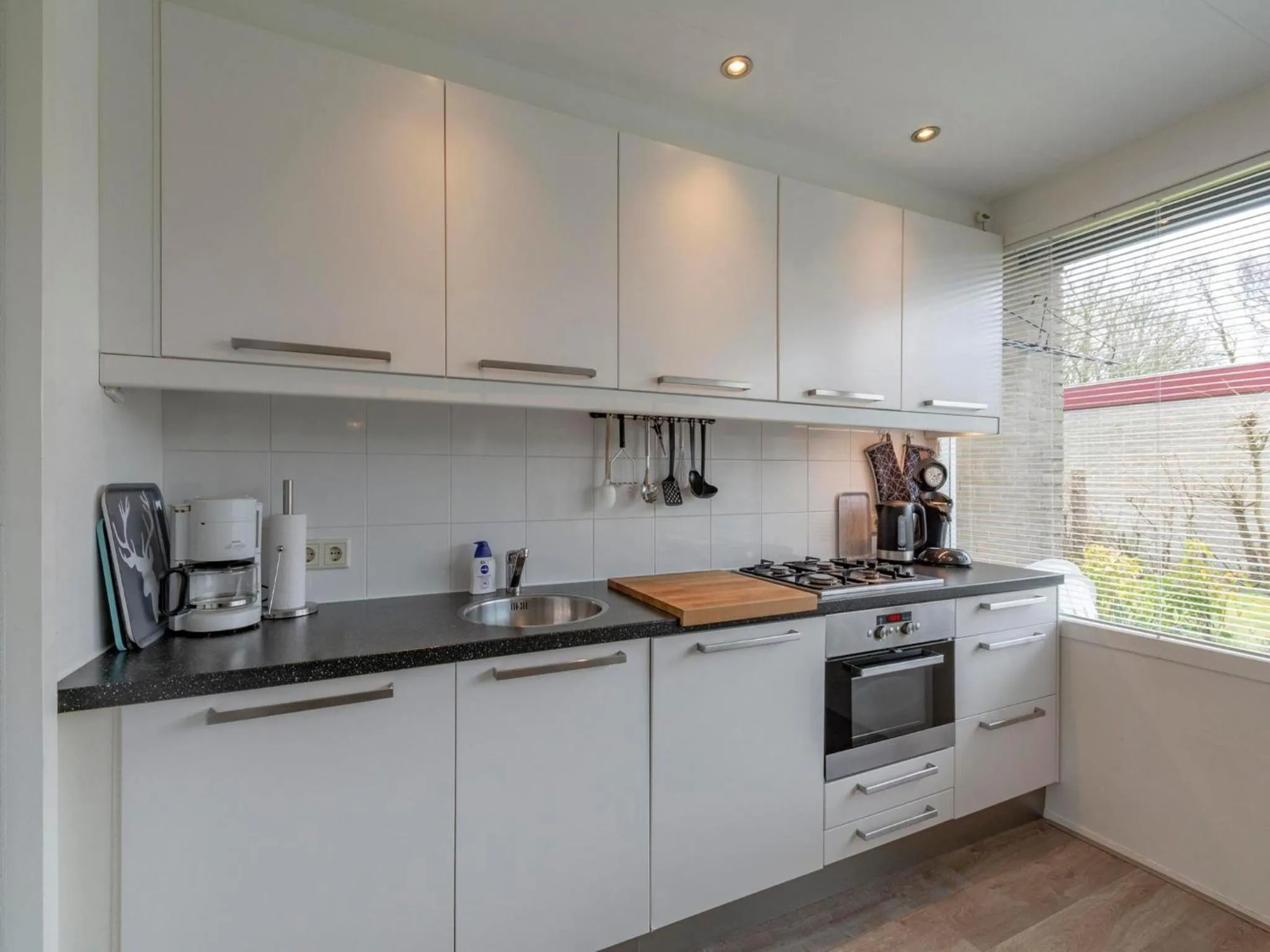 Kitchen or kitchenette in Bungalow near Dutch Beach & Family-Friendly Park
