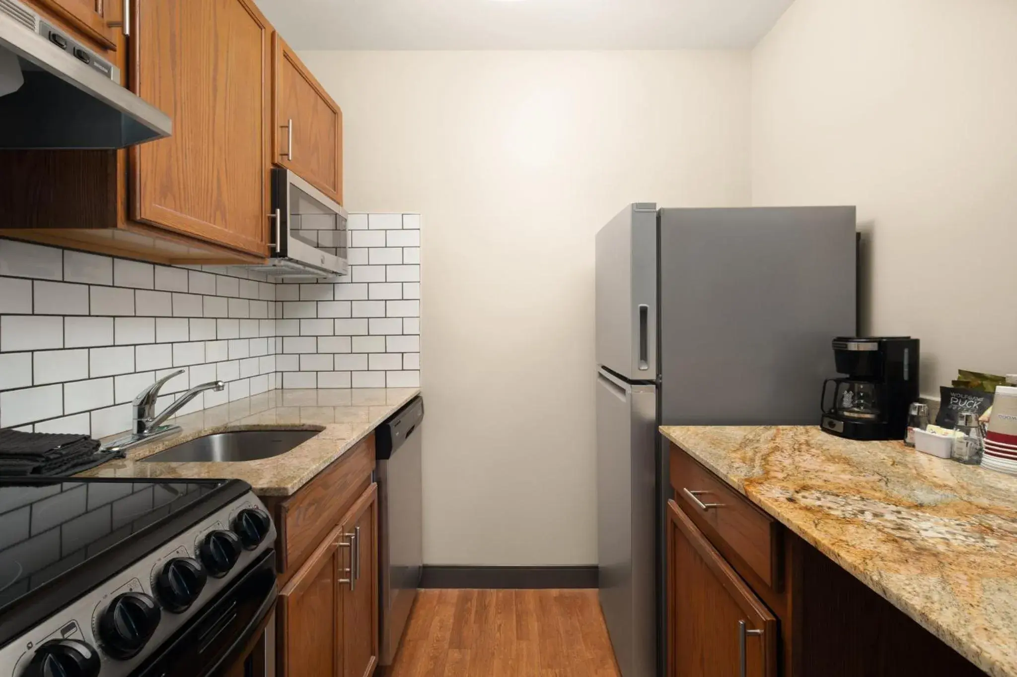 Photo of the whole room, Kitchen/Kitchenette in Candlewood Suites St Louis St Charles, an IHG Hotel