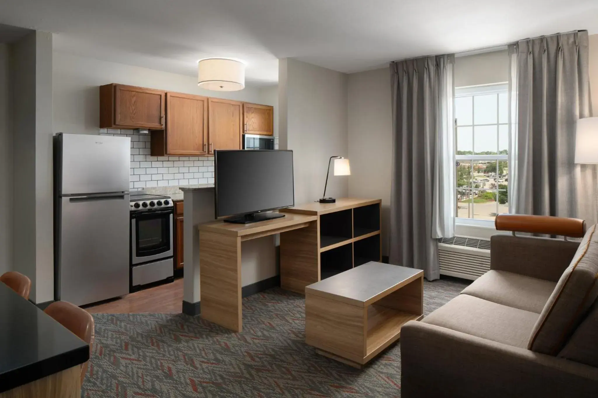 Photo of the whole room, Kitchen/Kitchenette in Candlewood Suites St Louis St Charles, an IHG Hotel
