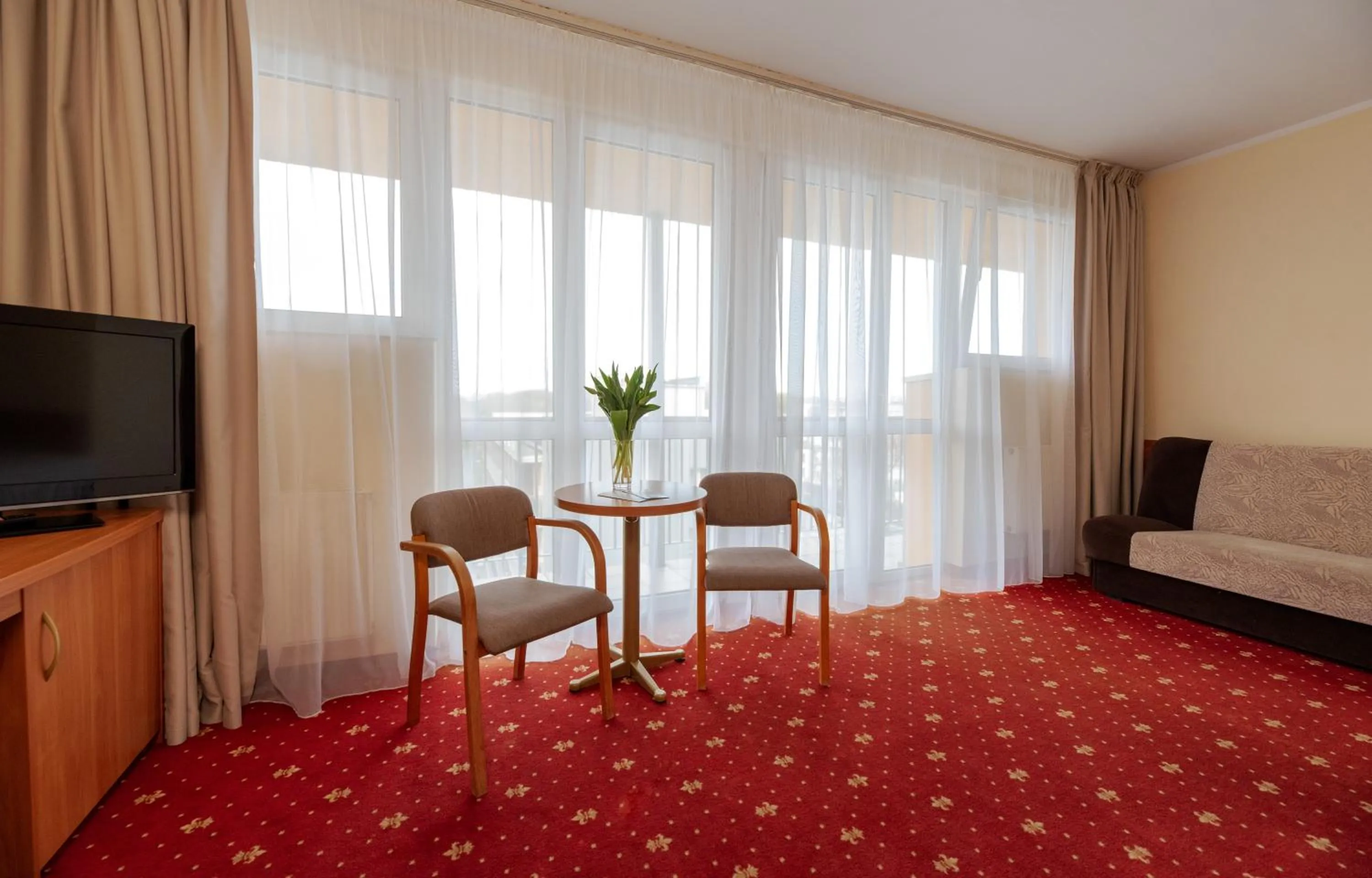 Communal lounge/ TV room, Bed in Interferie Chalkozyn w Kołobrzegu