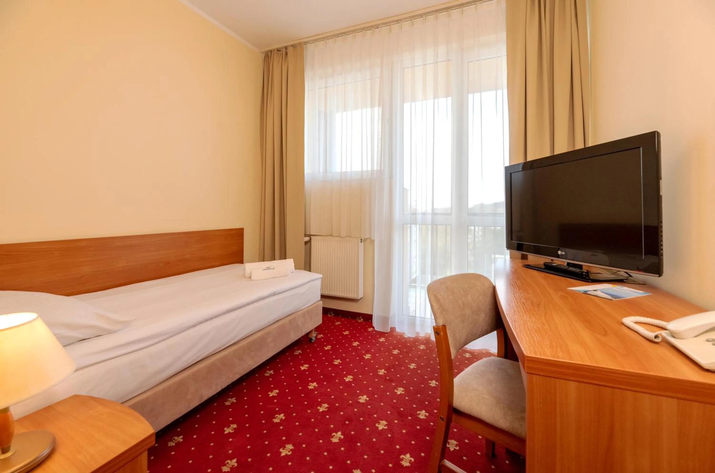 Communal lounge/ TV room, Bed in Interferie Chalkozyn w Kołobrzegu