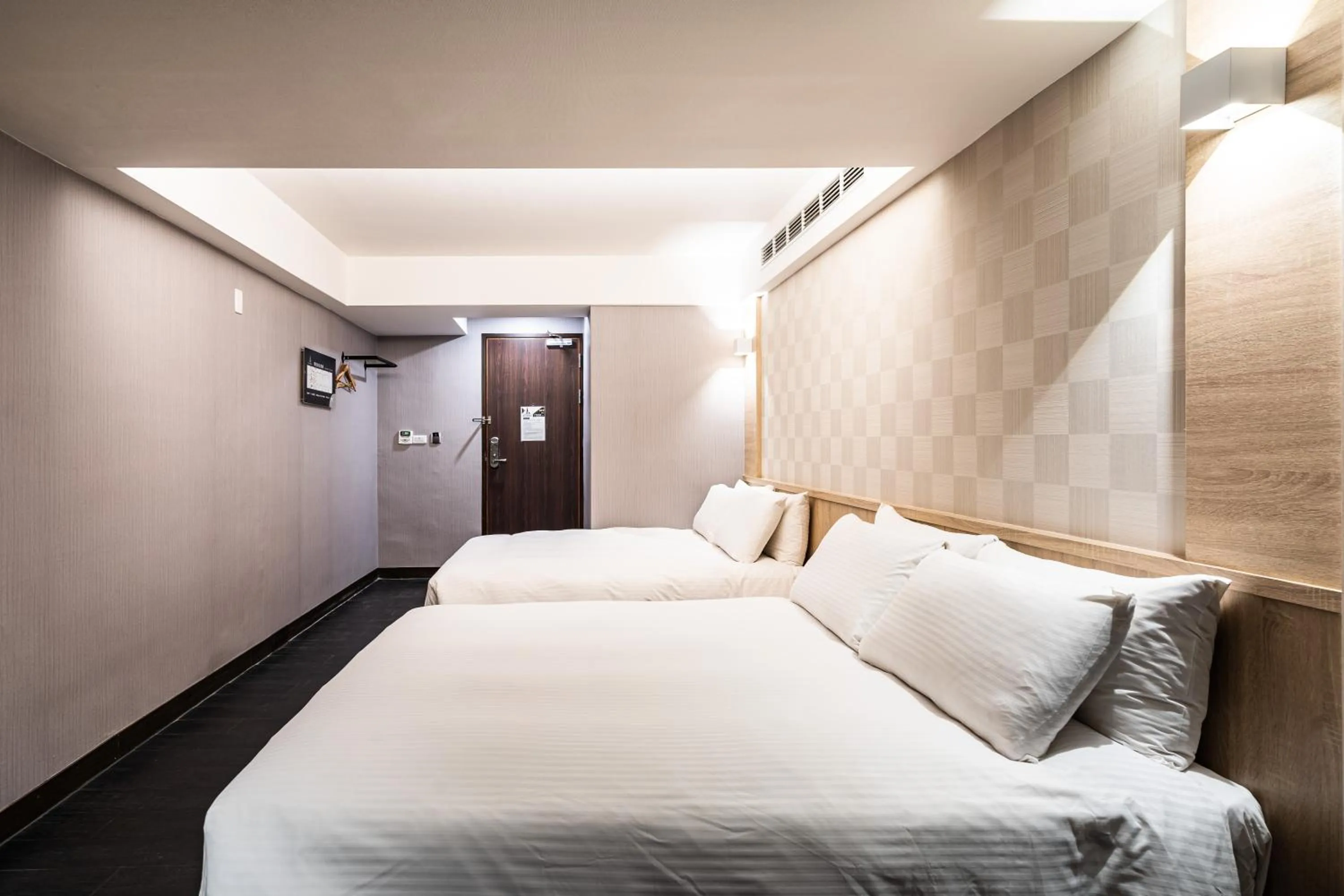 Bed in Global Traveler Hotel