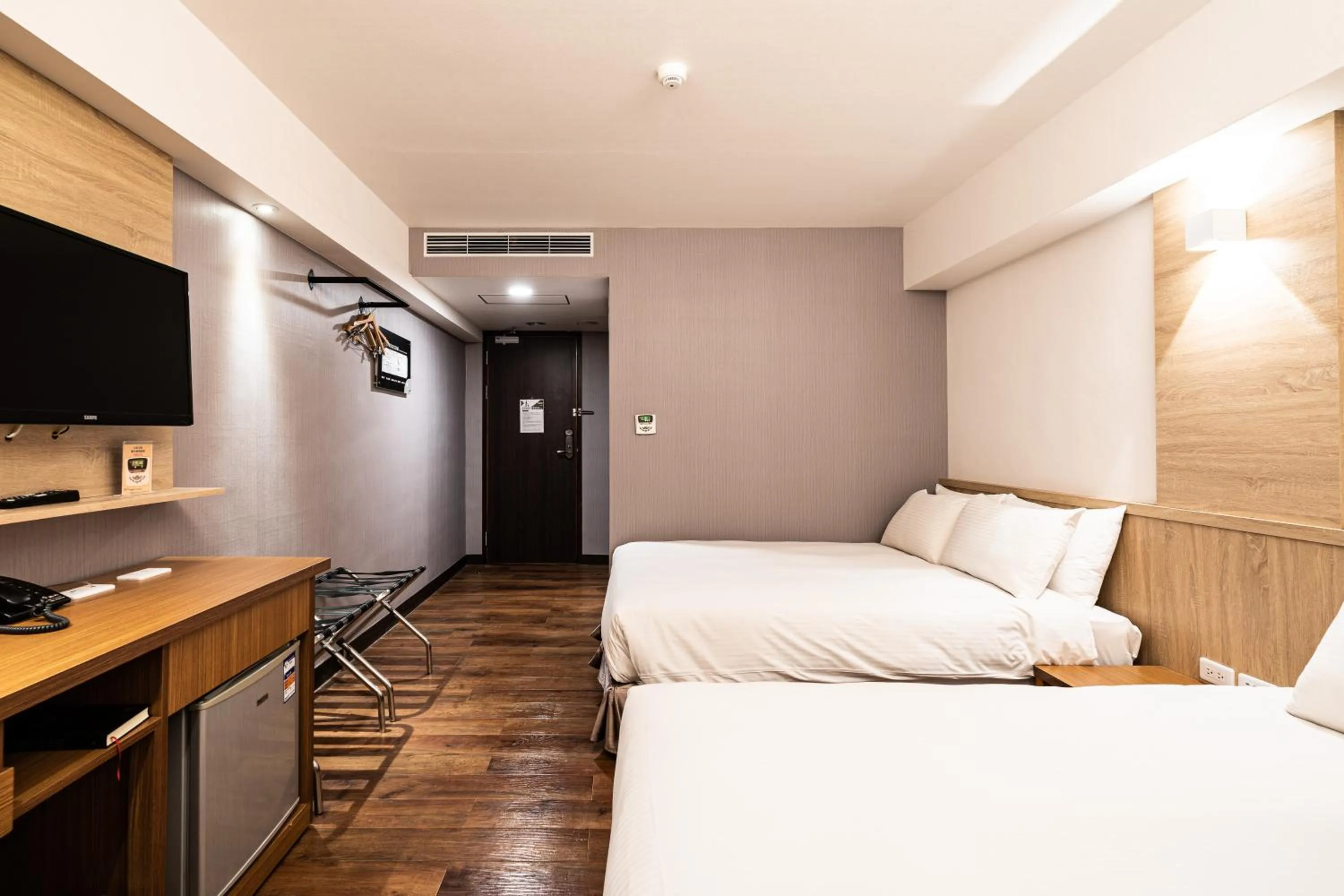 Bed in Global Traveler Hotel