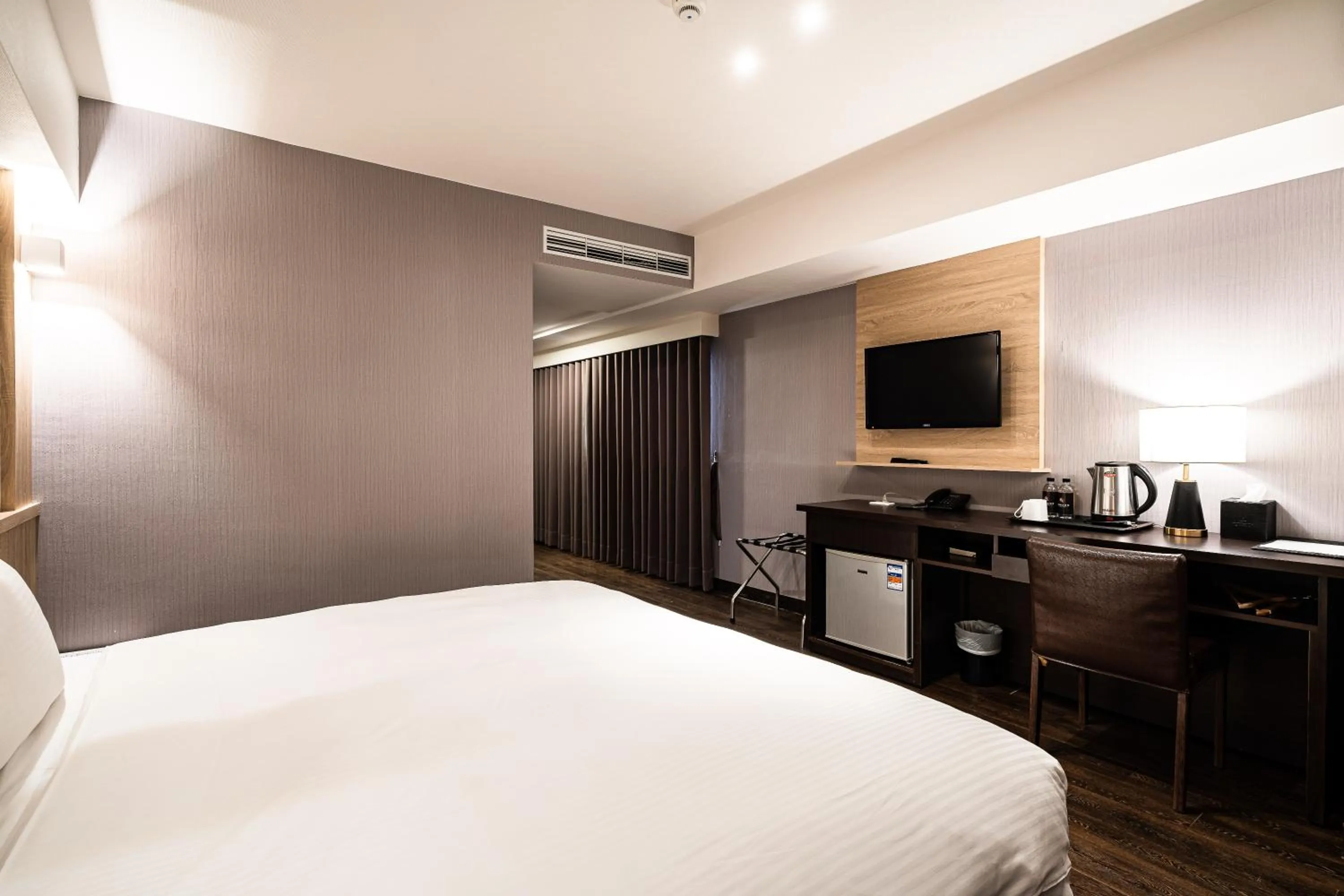 Bed in Global Traveler Hotel