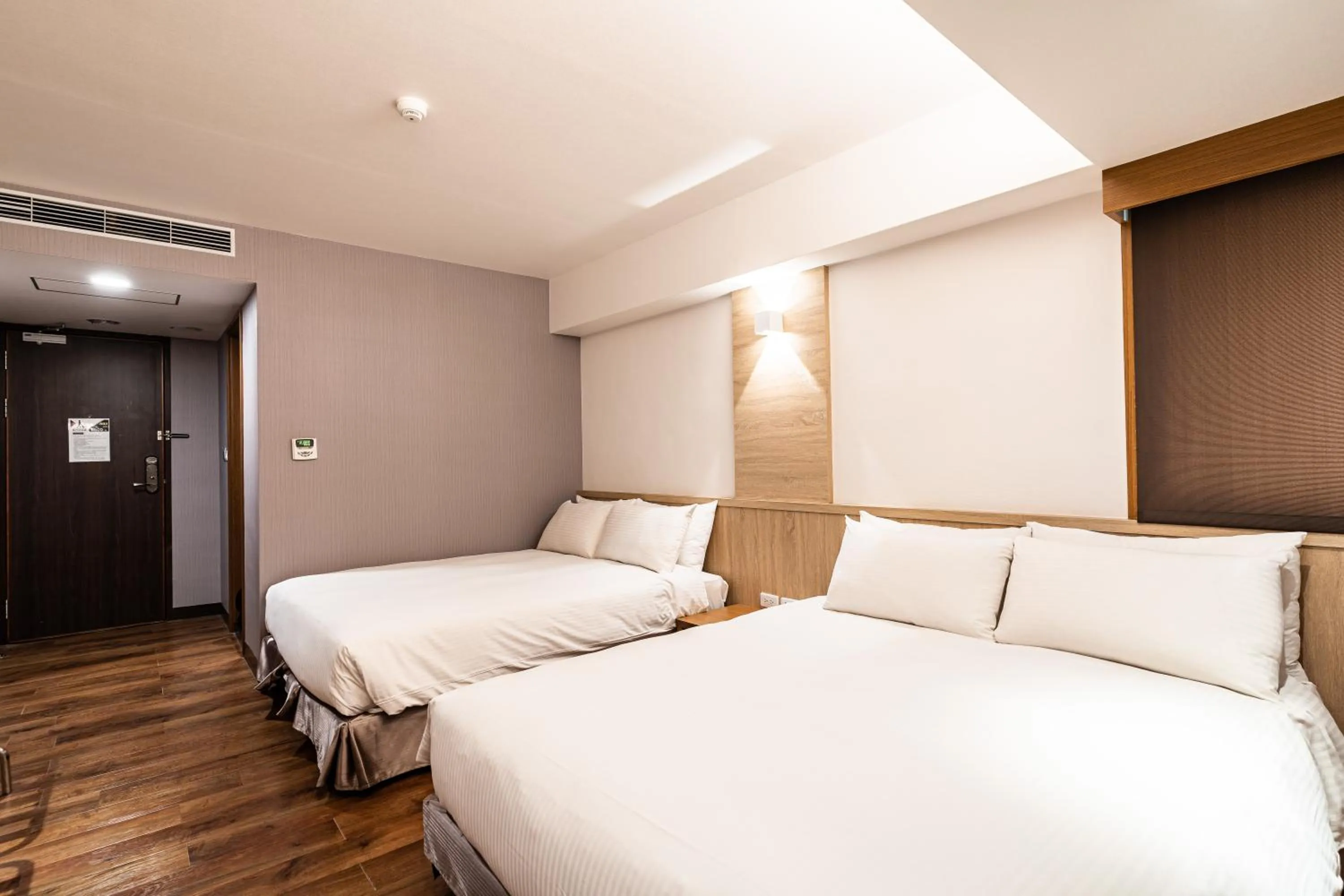 Bed in Global Traveler Hotel