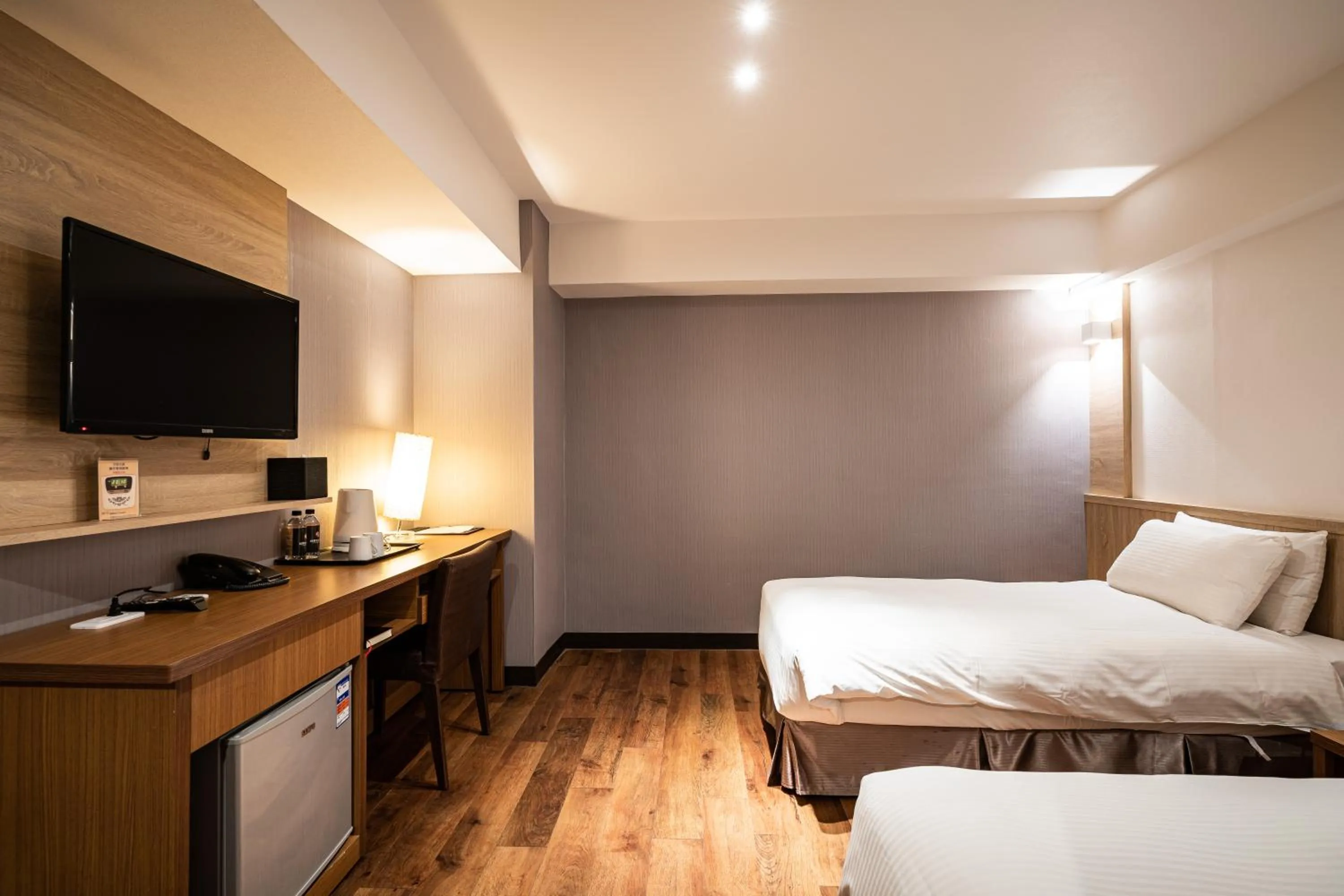 Bed in Global Traveler Hotel