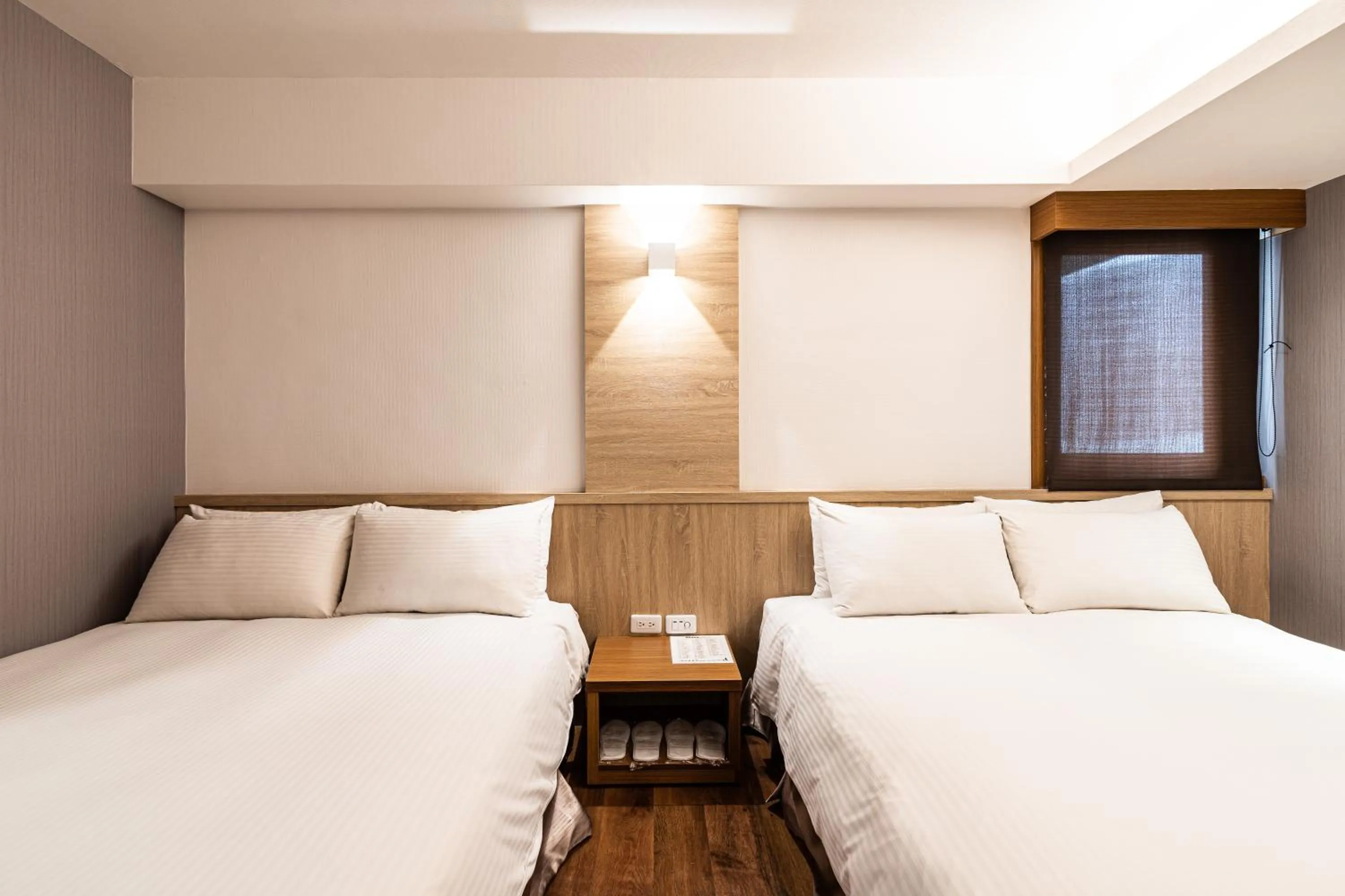 Bed in Global Traveler Hotel