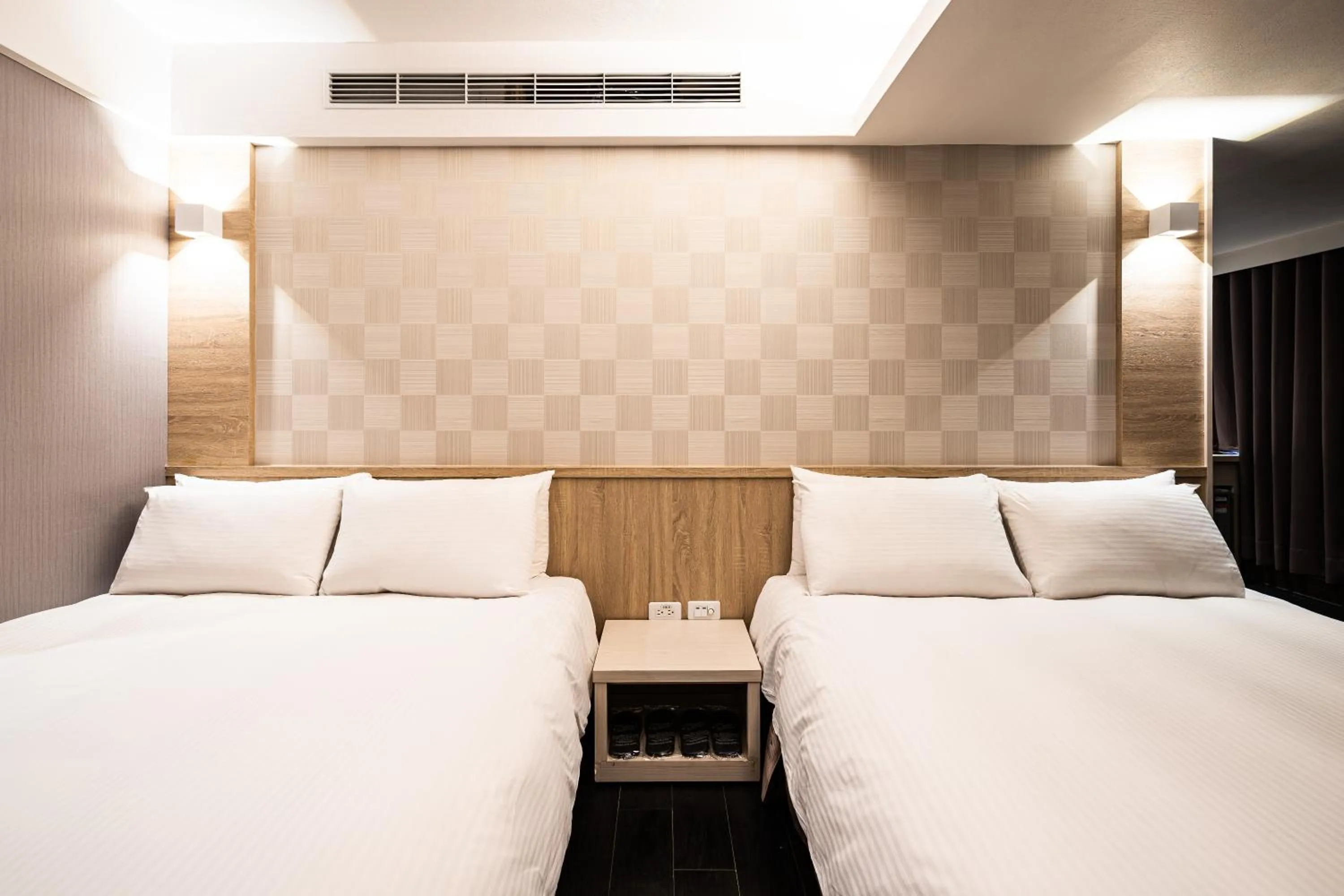 Bed in Global Traveler Hotel