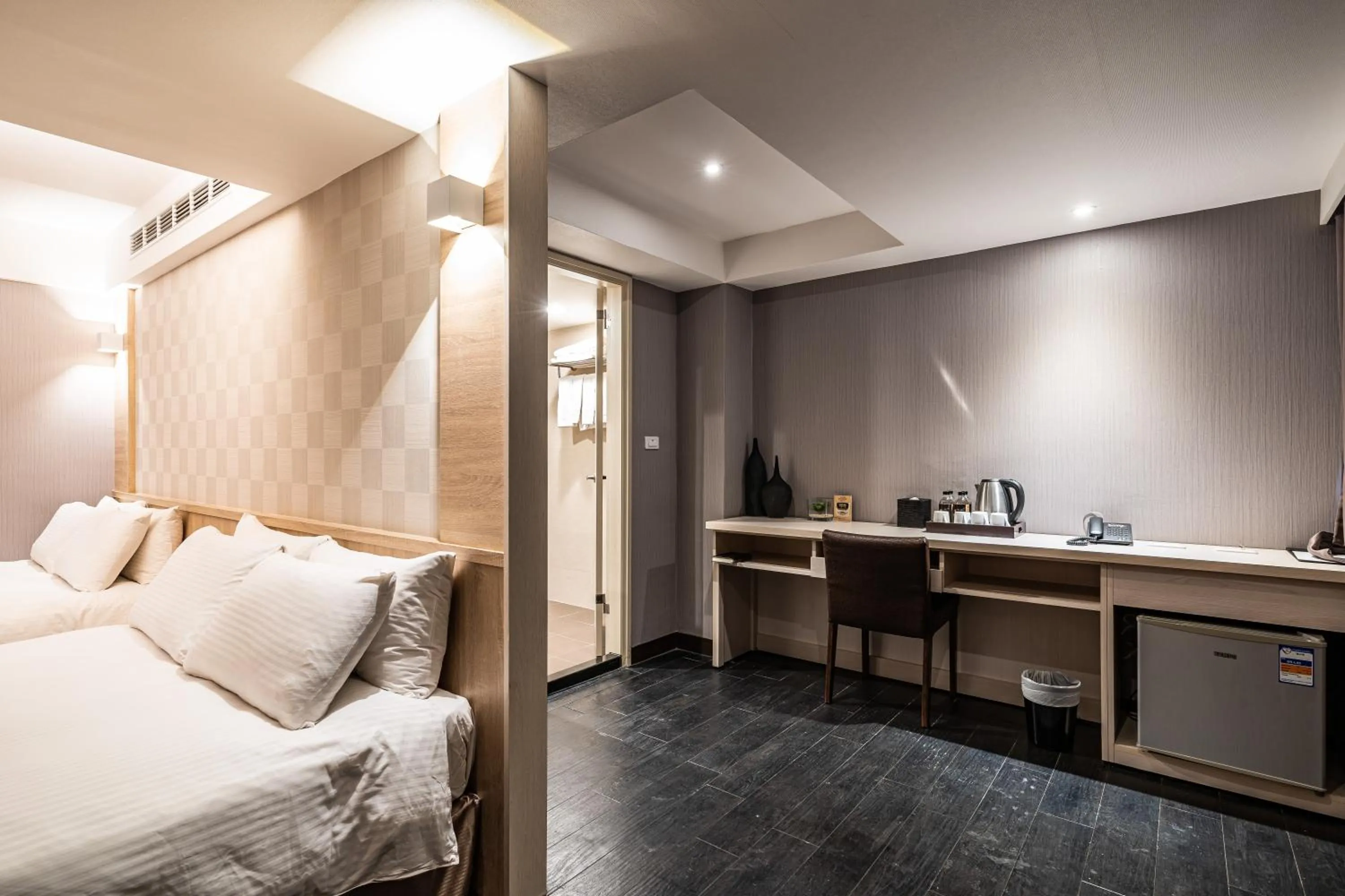 Bed in Global Traveler Hotel