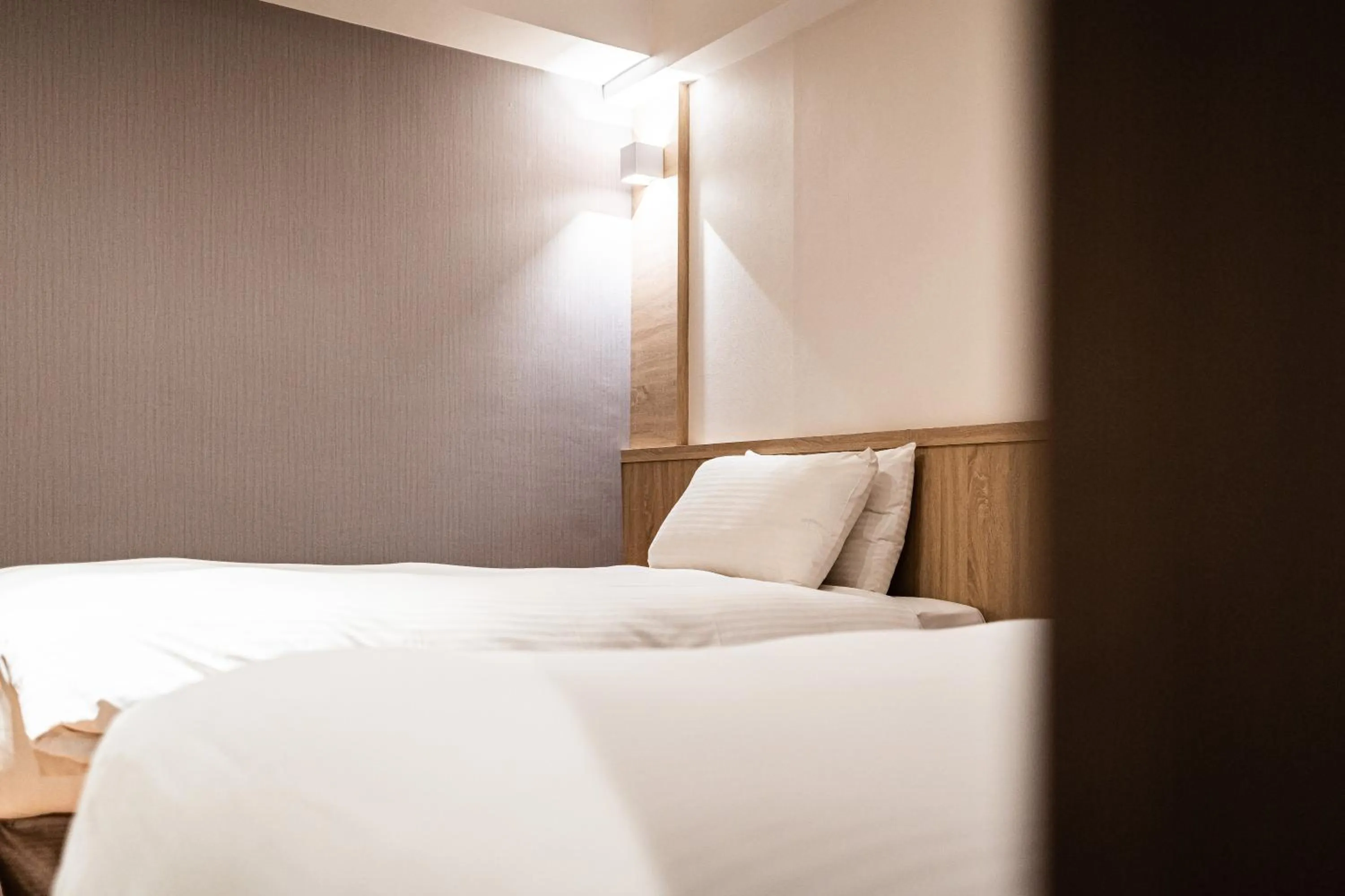 Bed in Global Traveler Hotel