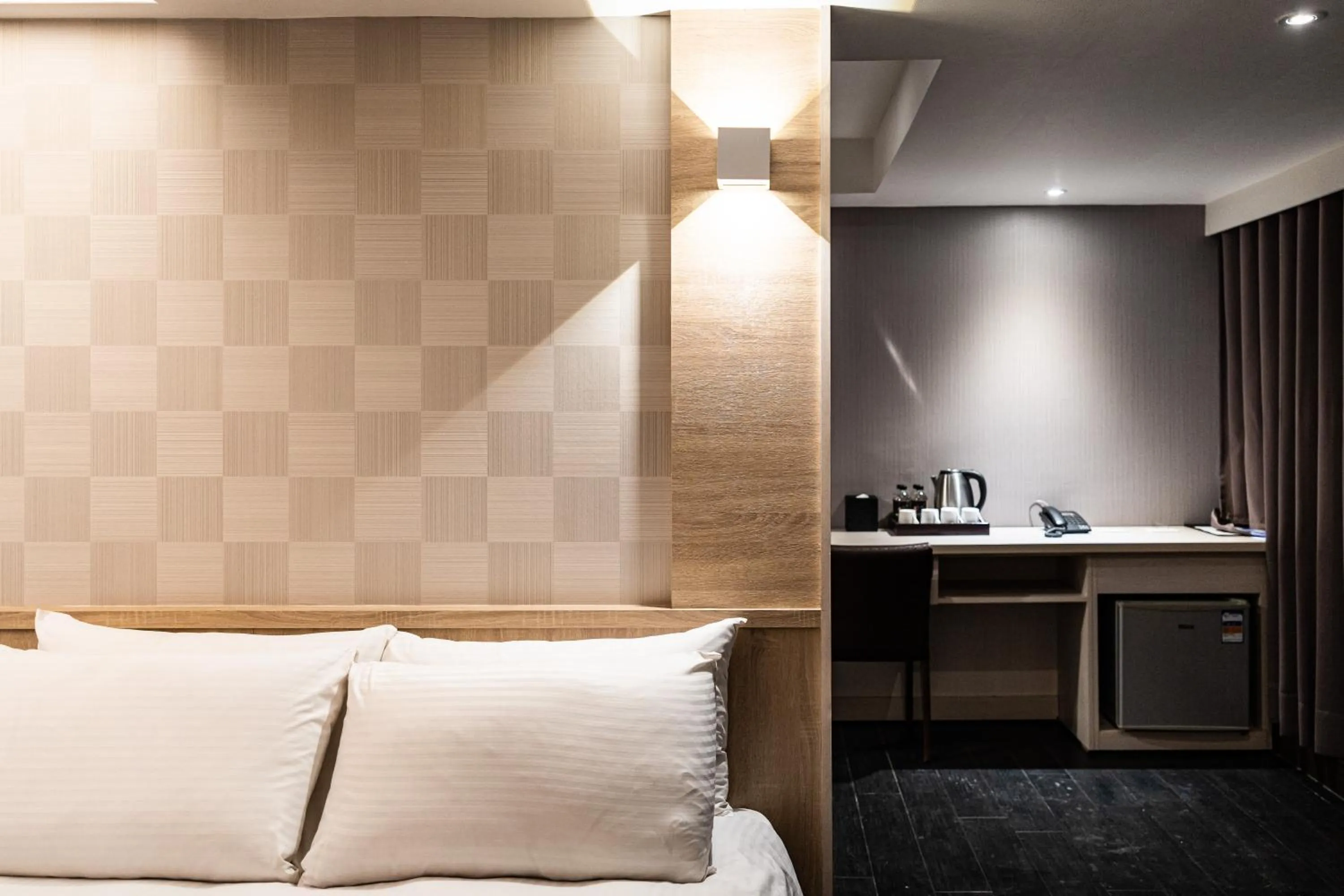 Bed in Global Traveler Hotel