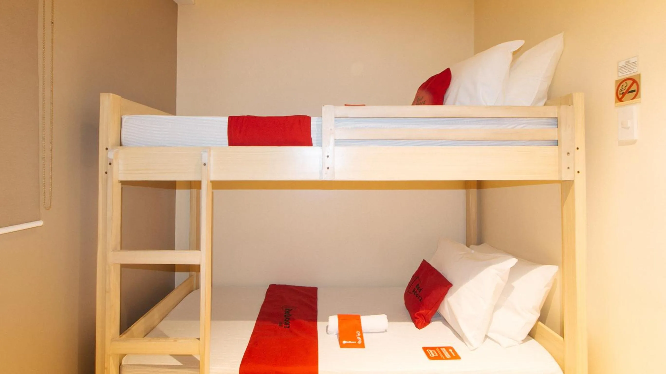 Bed in RedDoorz at Laiya Vivo Hotel Batangas