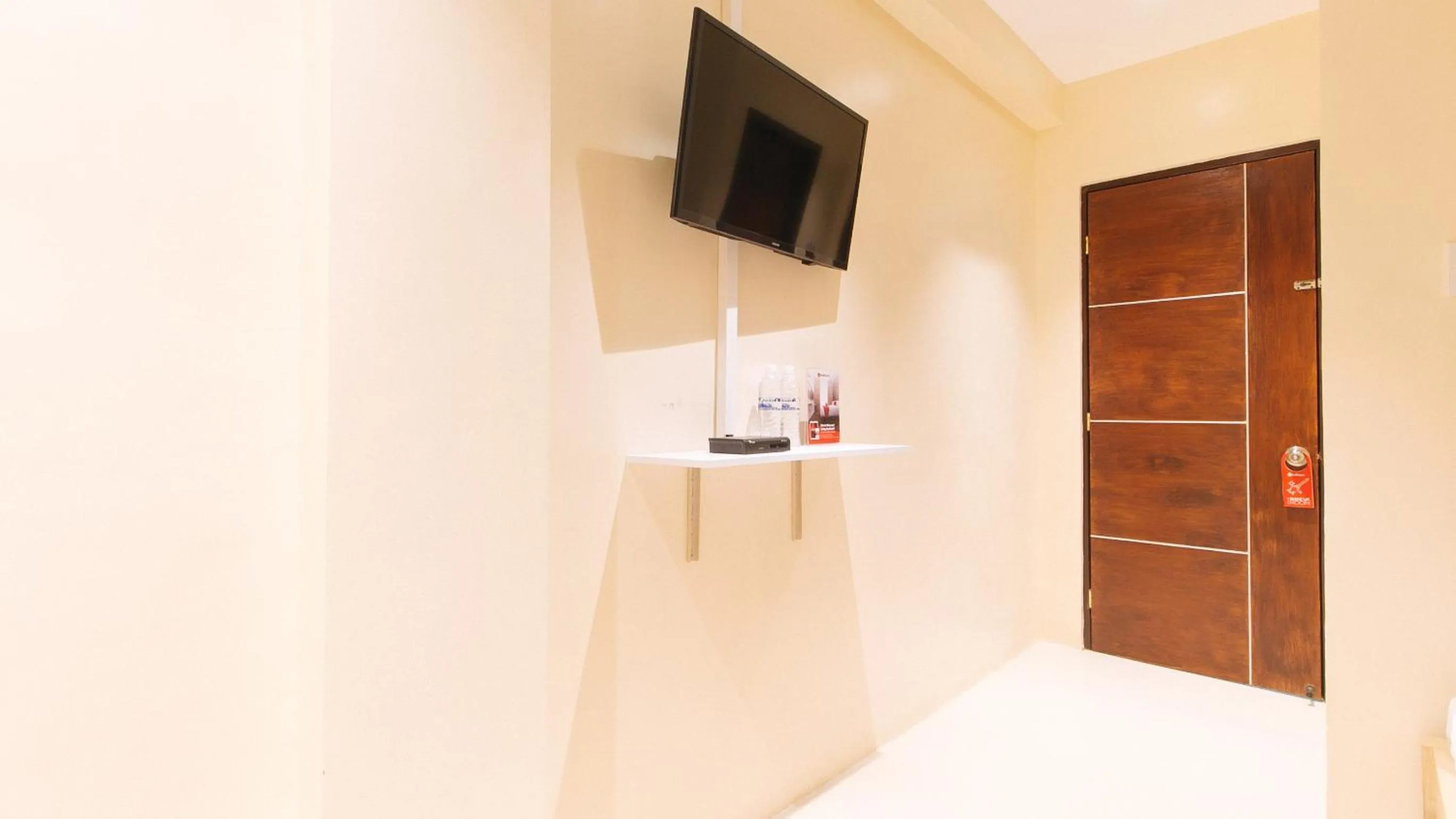 TV and multimedia in RedDoorz at Laiya Vivo Hotel Batangas