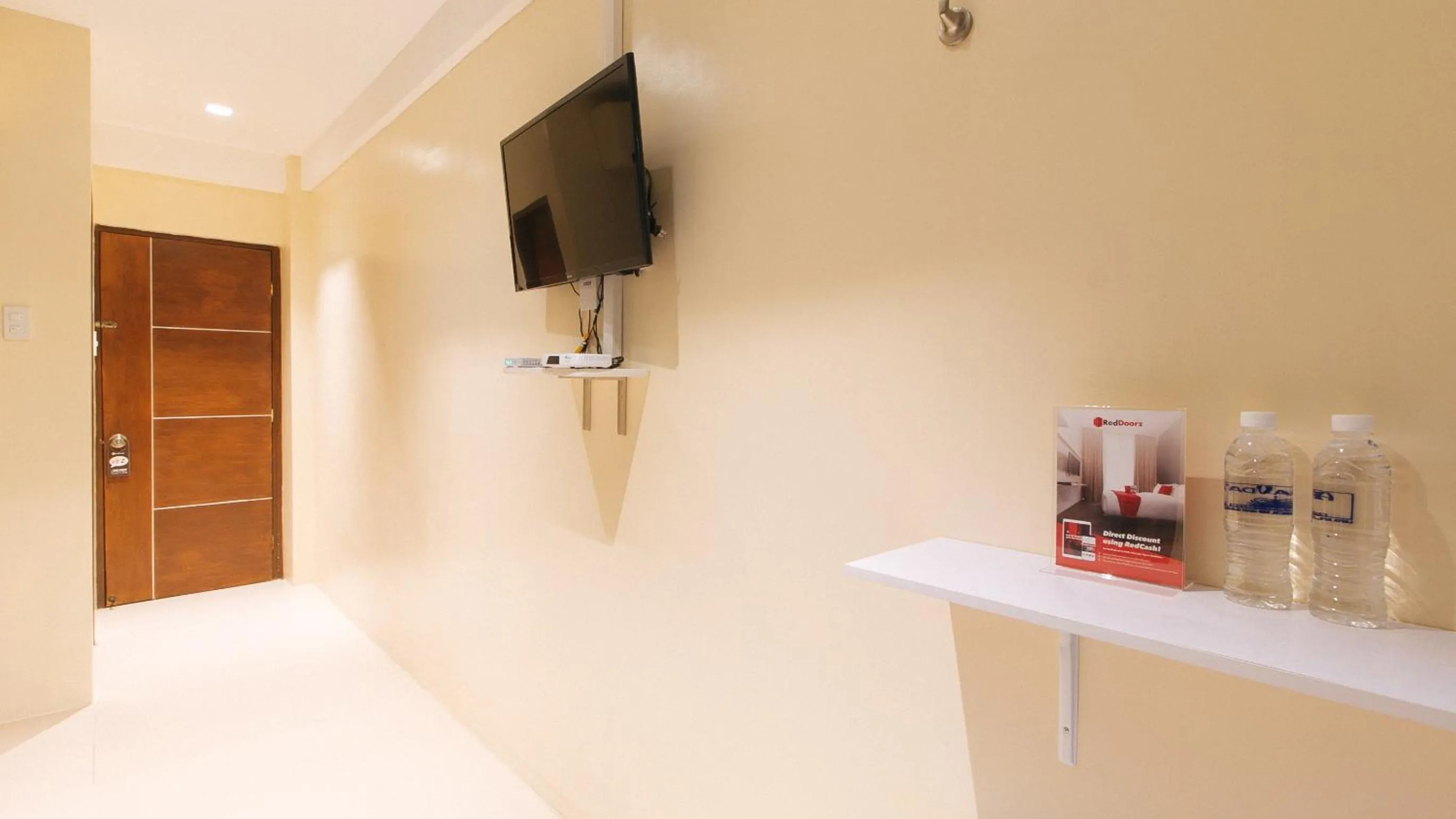 TV and multimedia in RedDoorz at Laiya Vivo Hotel Batangas