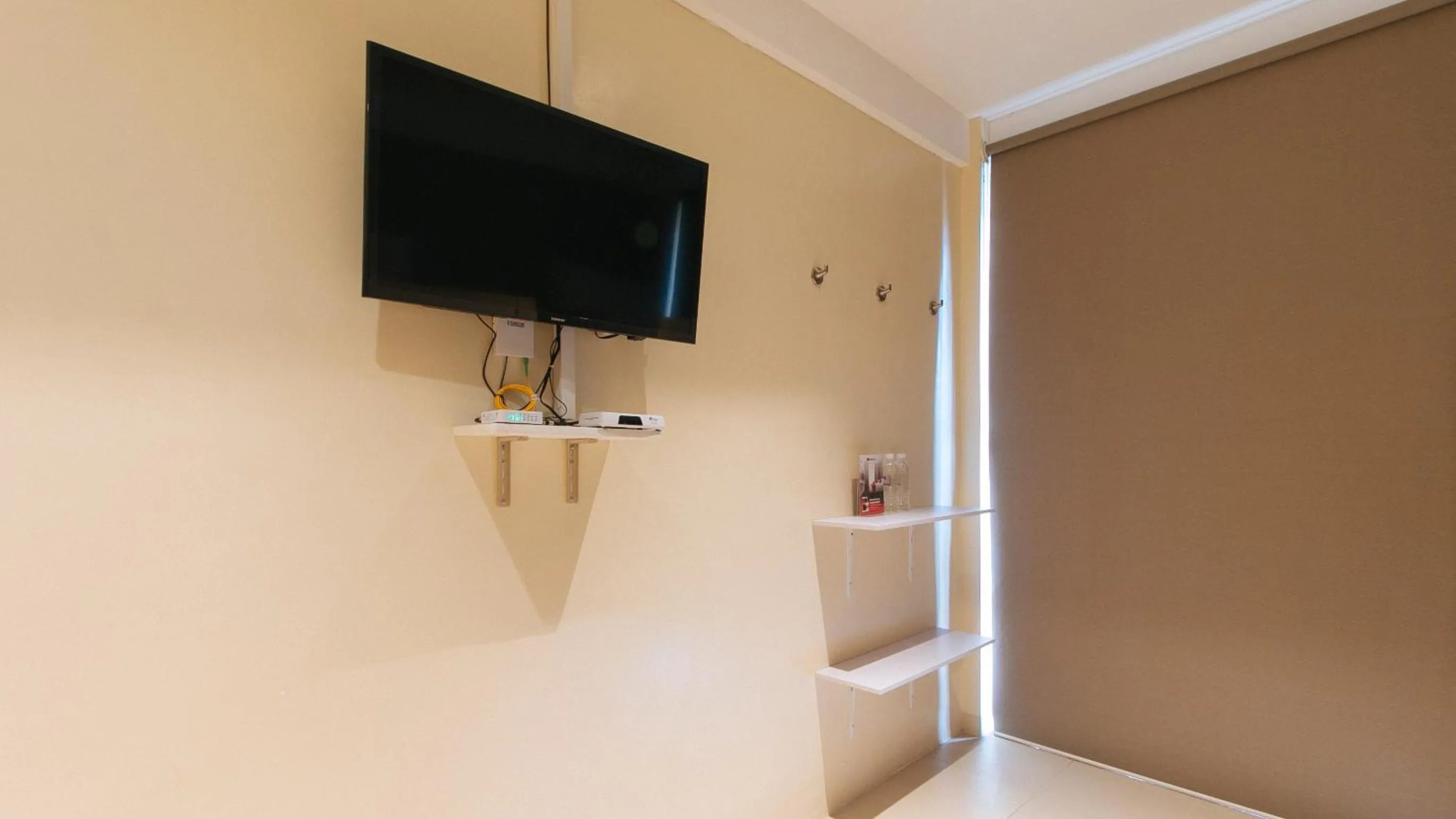 TV and multimedia in RedDoorz at Laiya Vivo Hotel Batangas