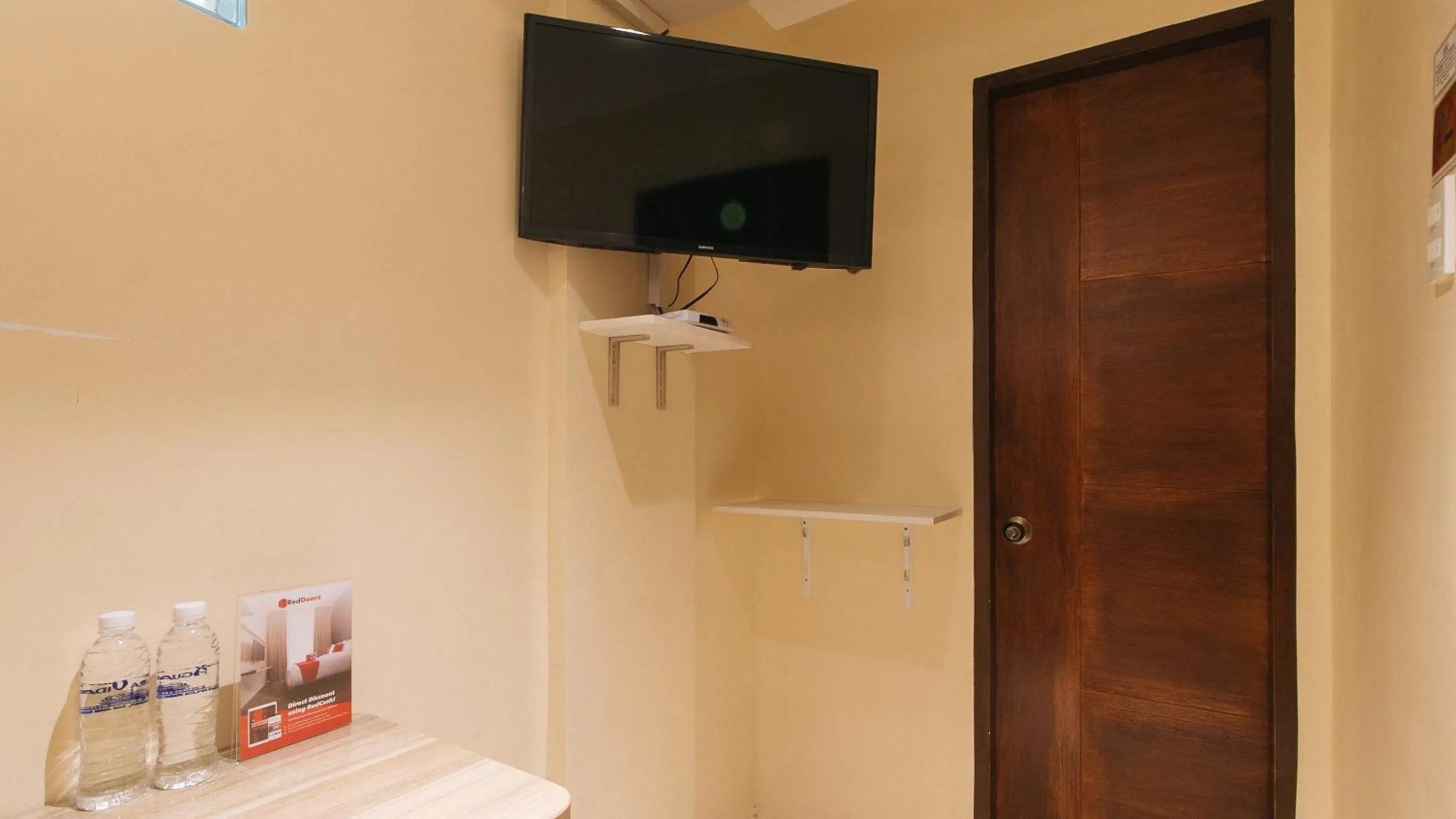 TV and multimedia in RedDoorz at Laiya Vivo Hotel Batangas