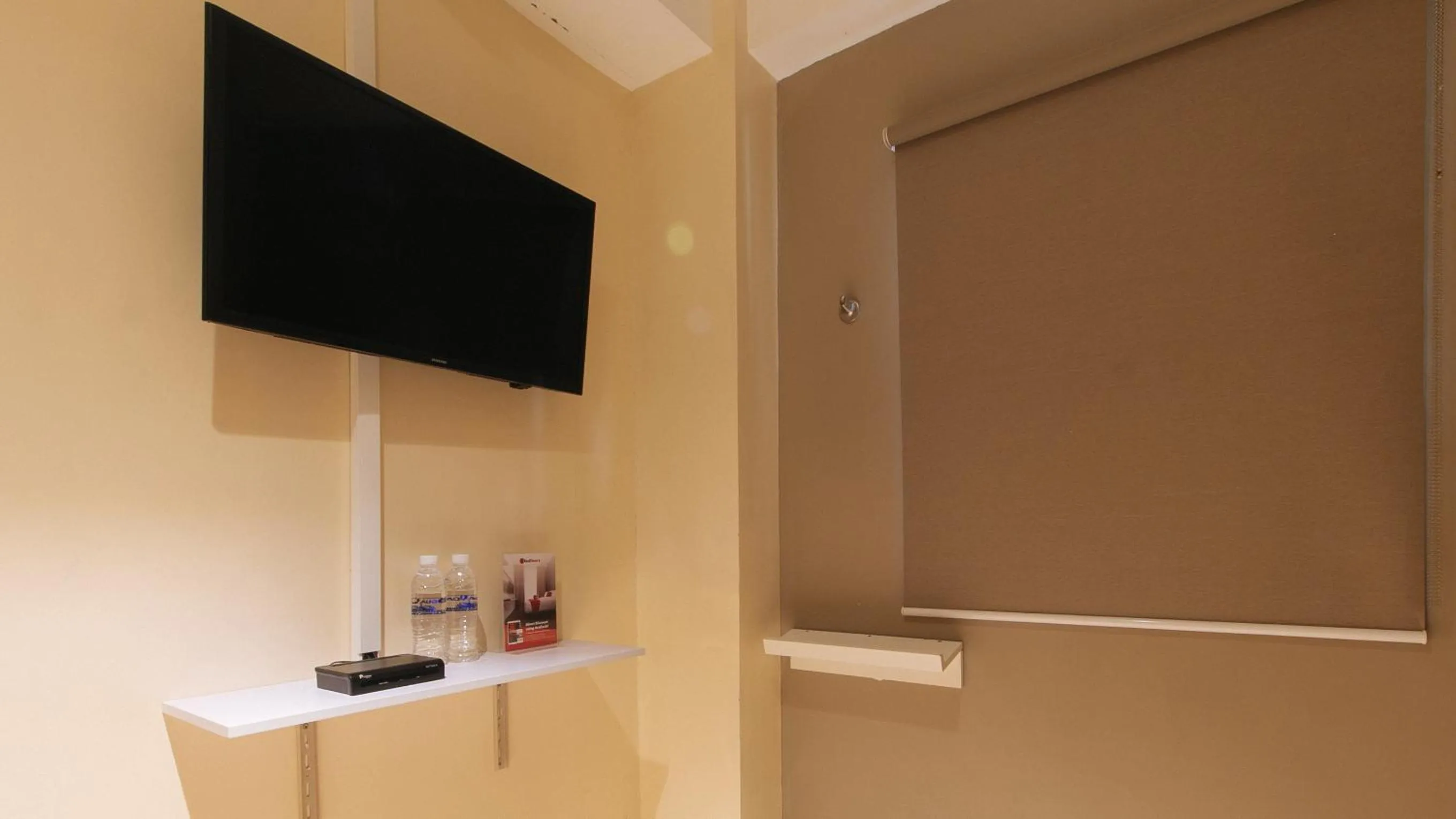 TV and multimedia in RedDoorz at Laiya Vivo Hotel Batangas