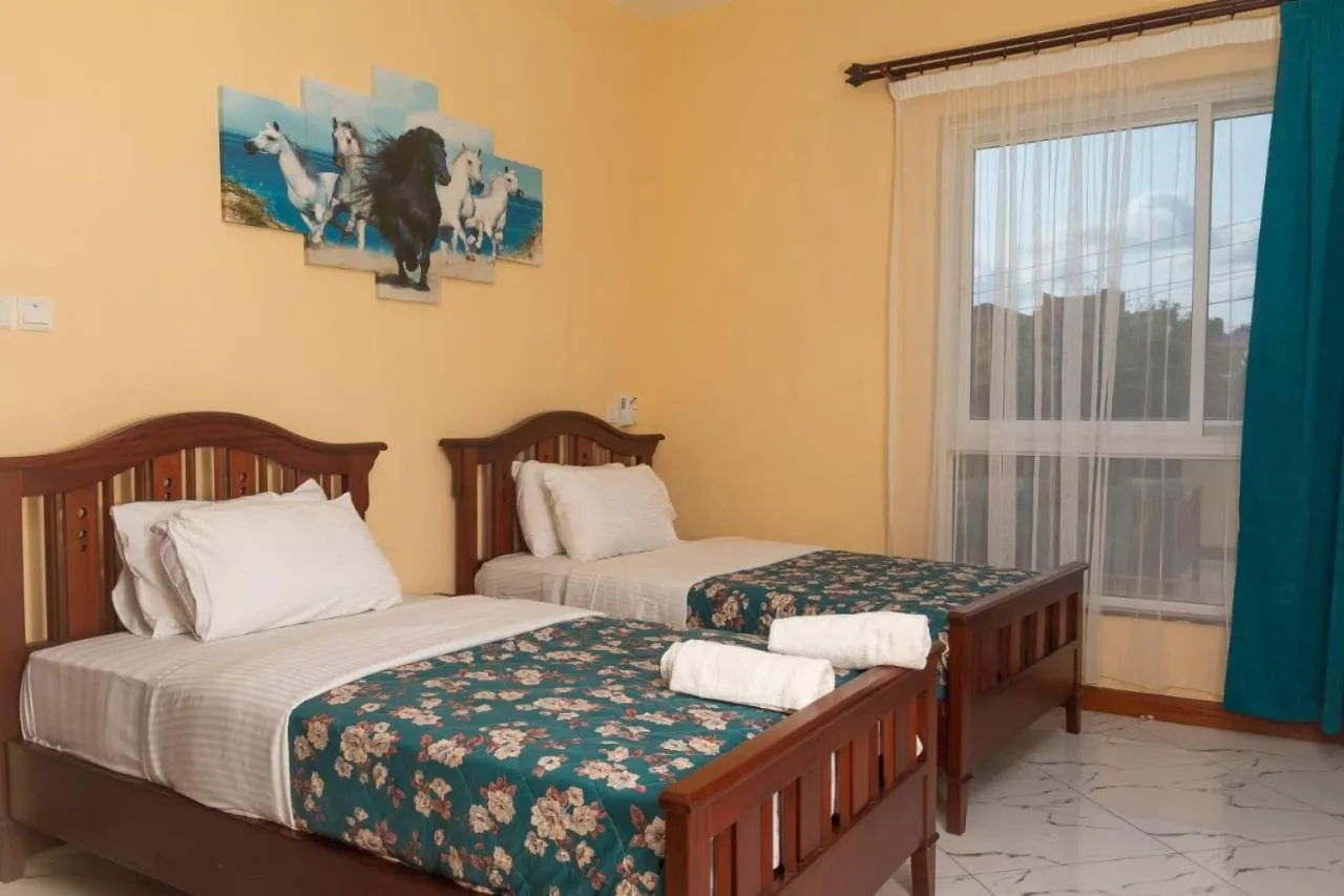 Bed in Lux Suites Le Royal Apartments Nyali