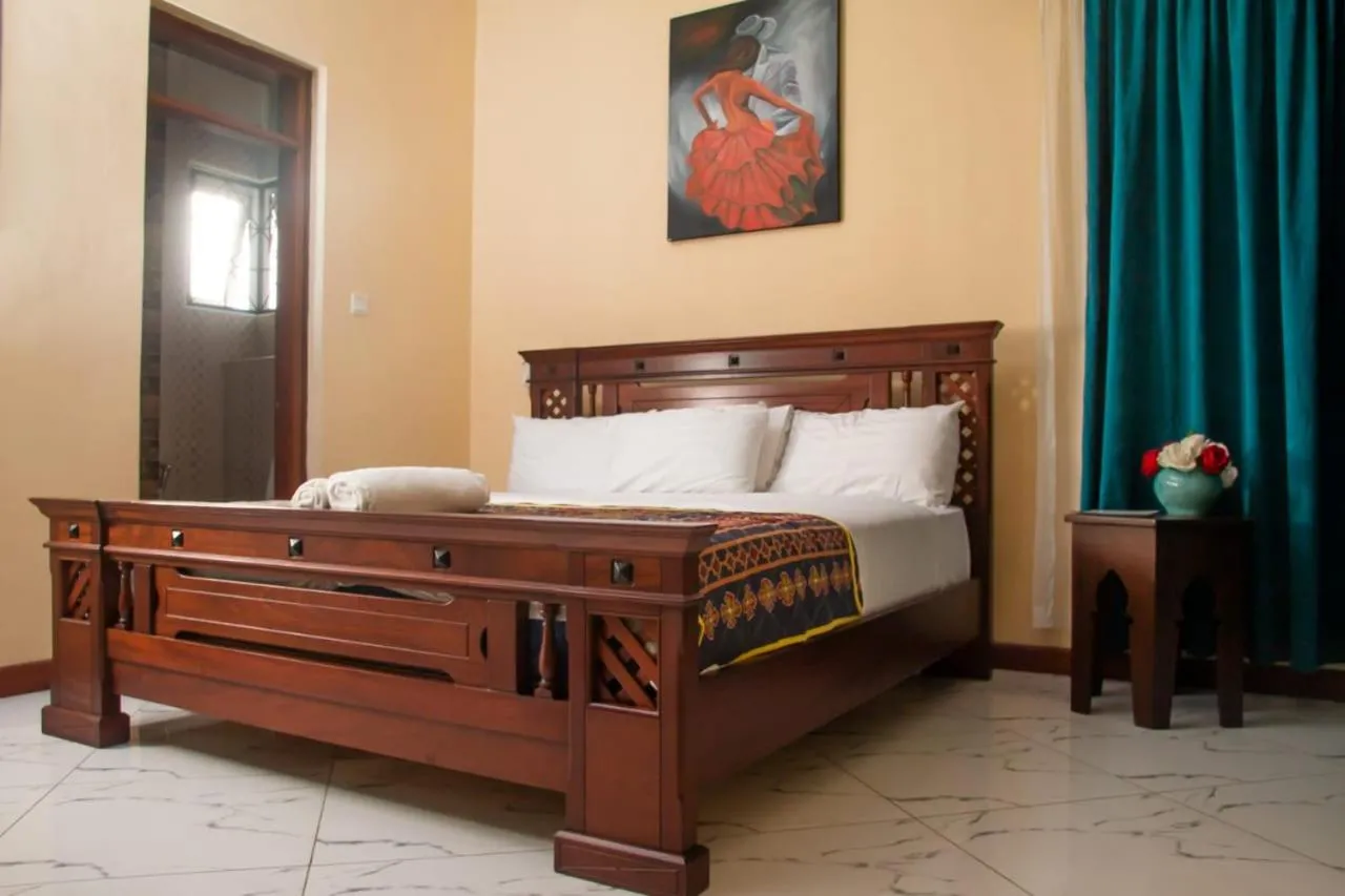 Bed in Lux Suites Le Royal Apartments Nyali
