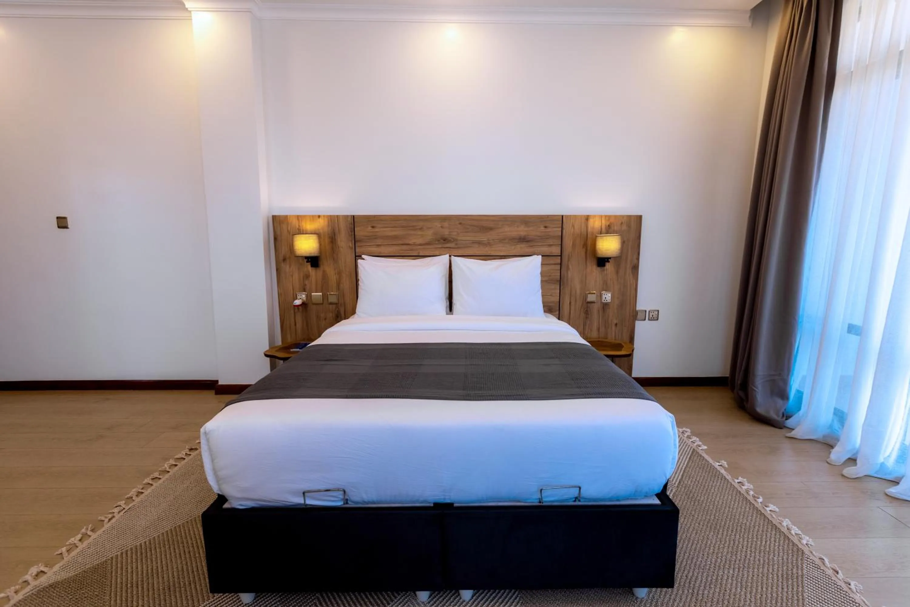 Photo of the whole room, Bed in MAYA Residences Rwanda