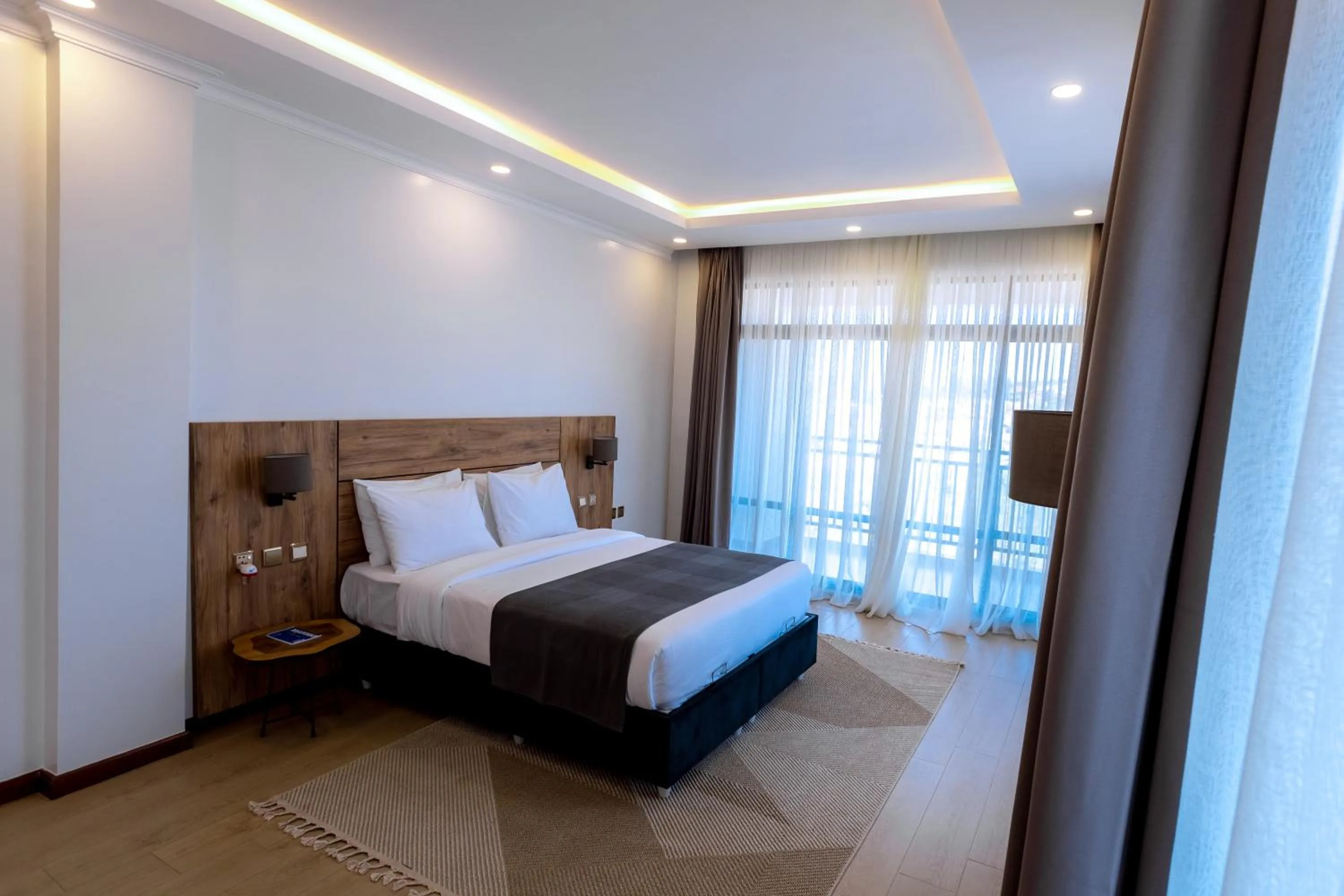 Photo of the whole room, Bed in MAYA Residences Rwanda