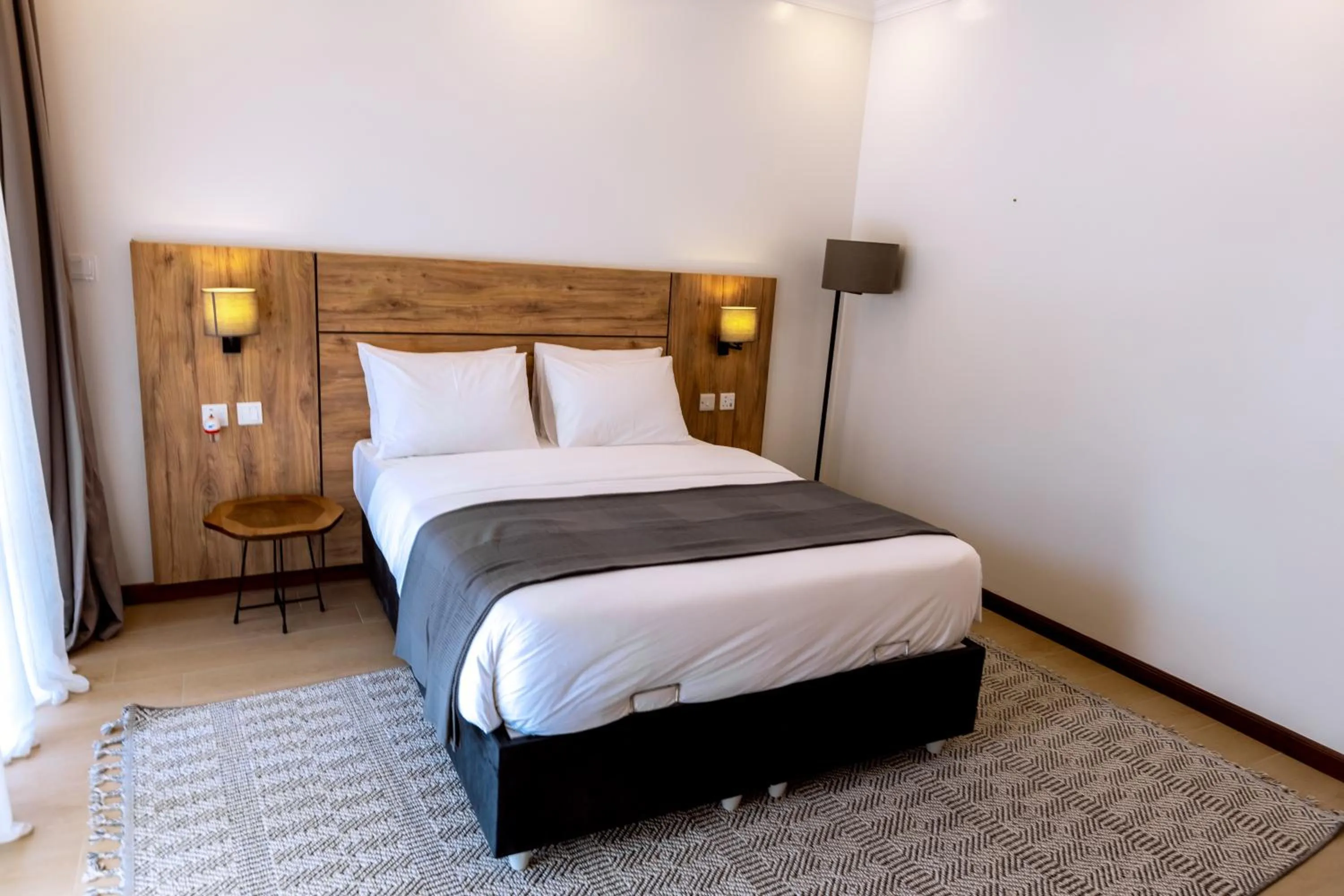 Photo of the whole room, Bed in MAYA Residences Rwanda