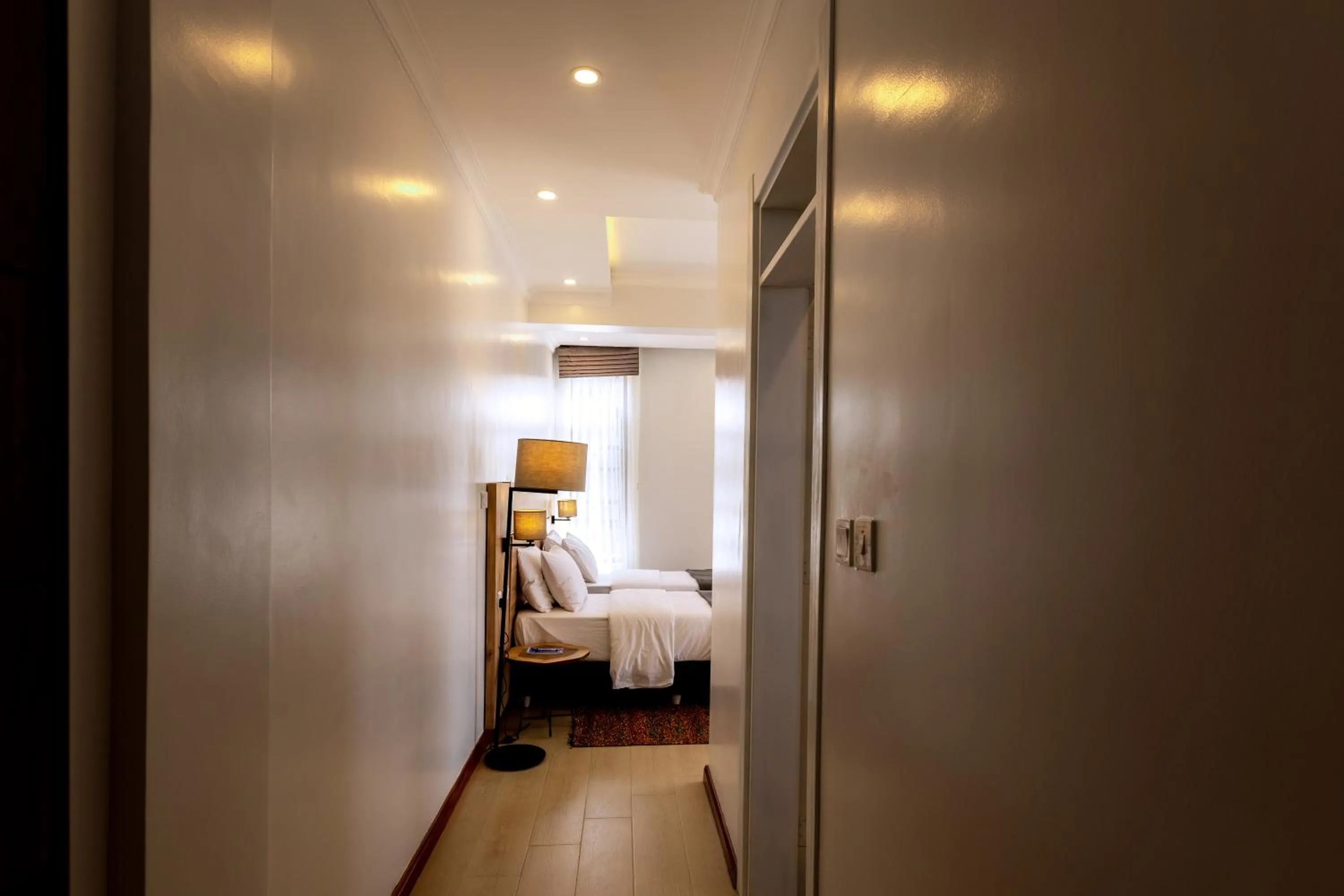 Photo of the whole room, Bed in MAYA Residences Rwanda