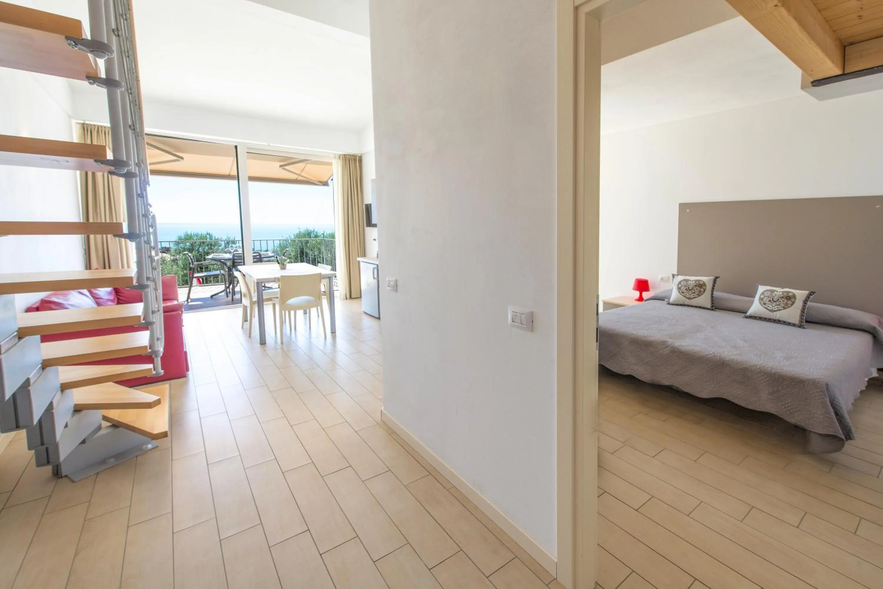 Living room, Bed in La Chioma di Berenice Garda Residence