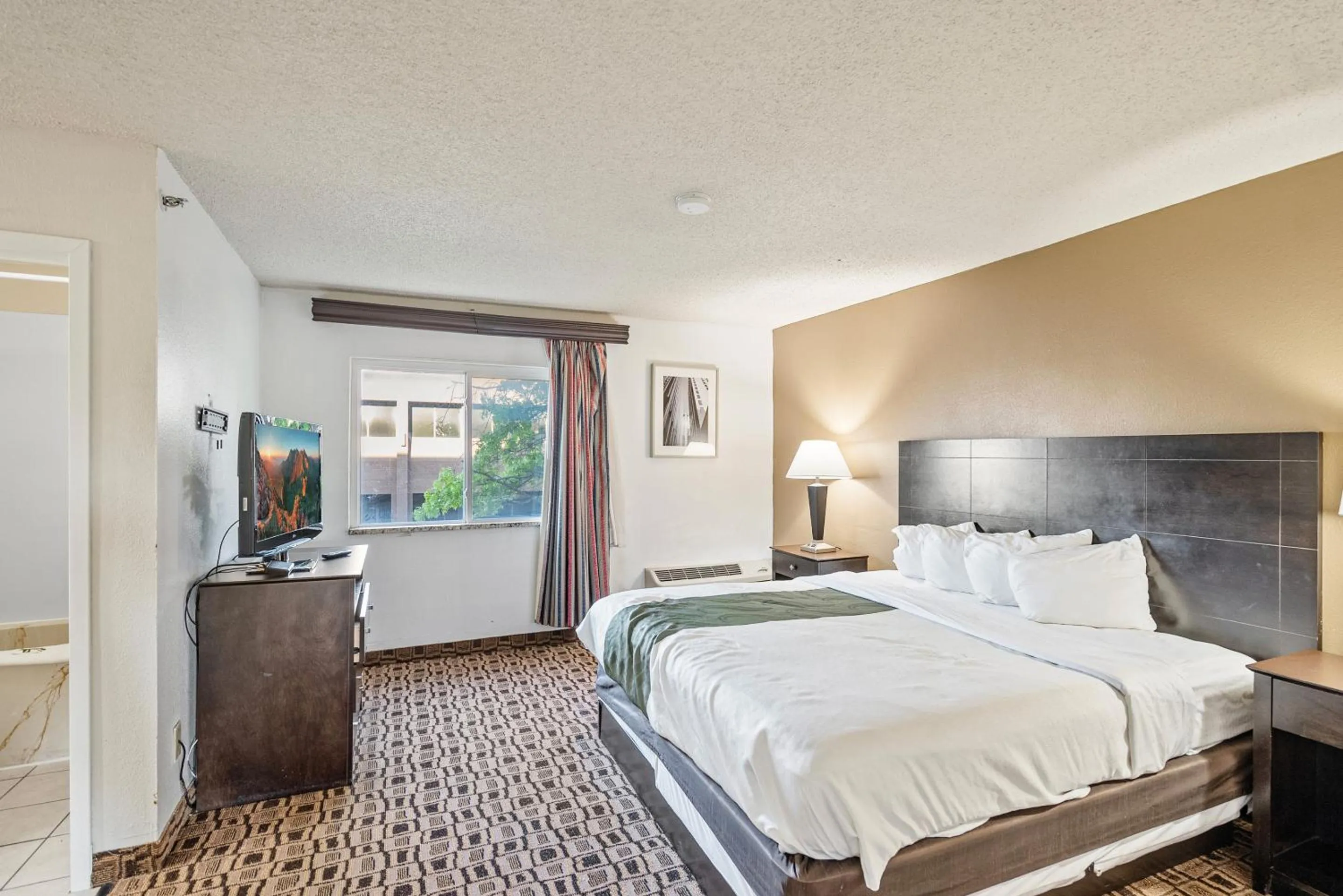 Bedroom, Bed in Coratel Suites