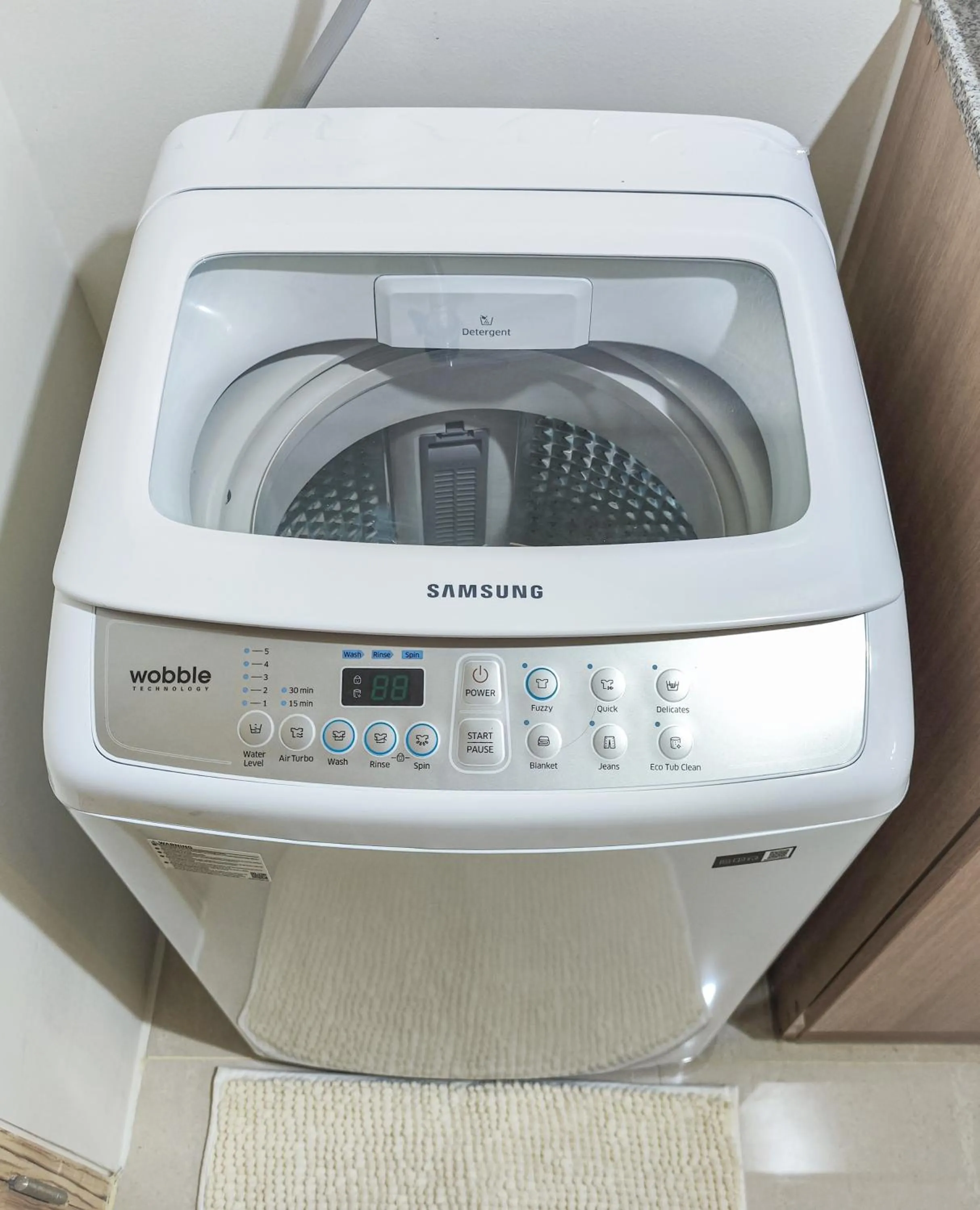 washing machine in White Nordic Fully-Furnished Studio at INSPIRIA