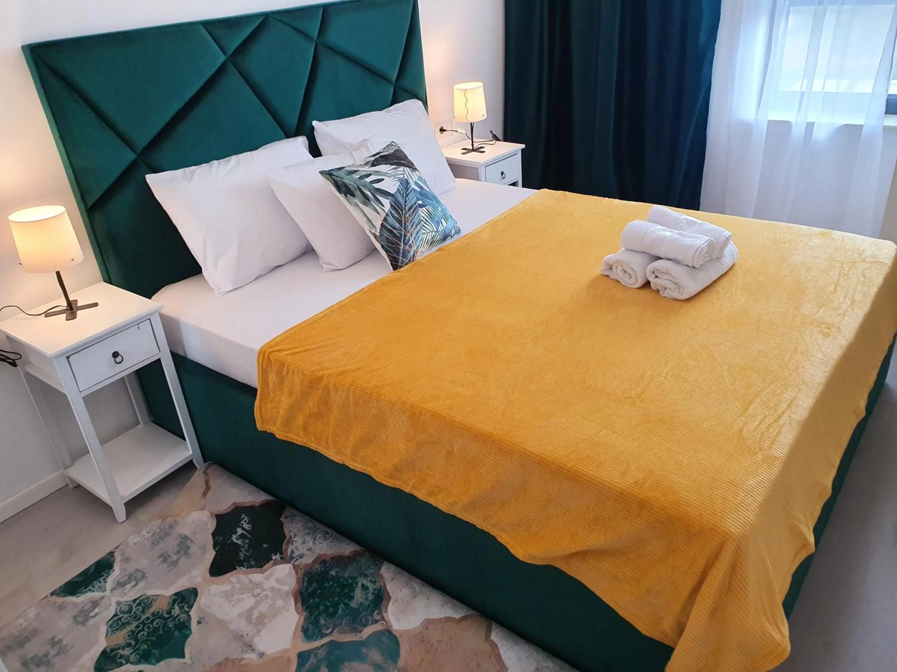 Bed in Grey Residence Apartments