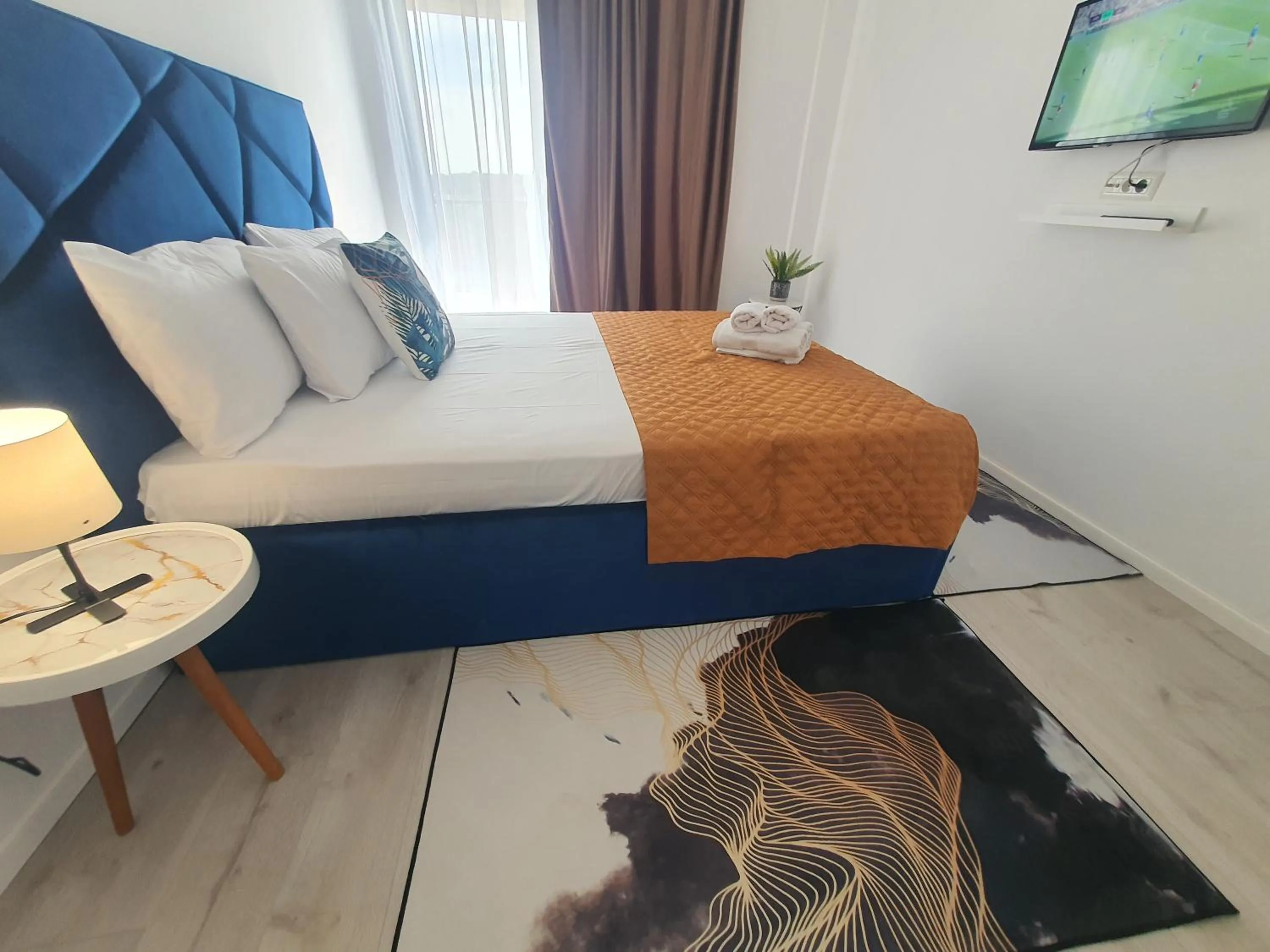 Bed in Grey Residence Apartments