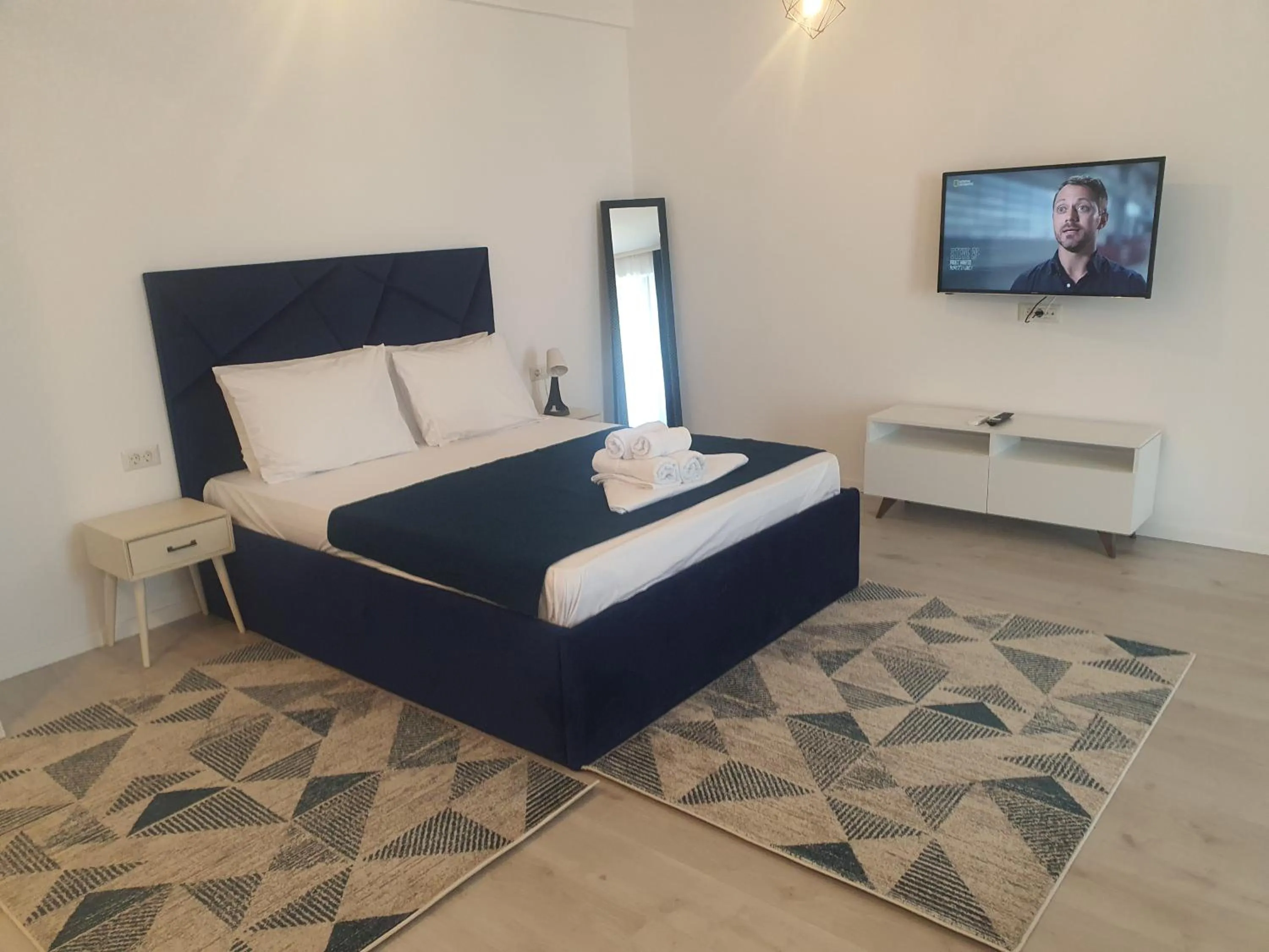 Bed in Grey Residence Apartments