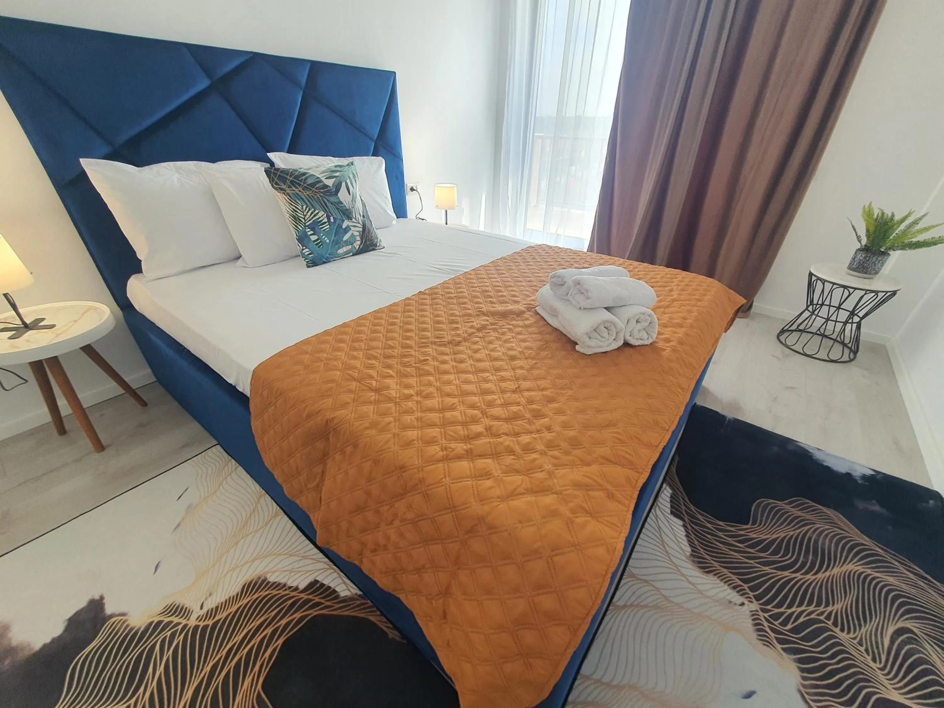 Bed in Grey Residence Apartments