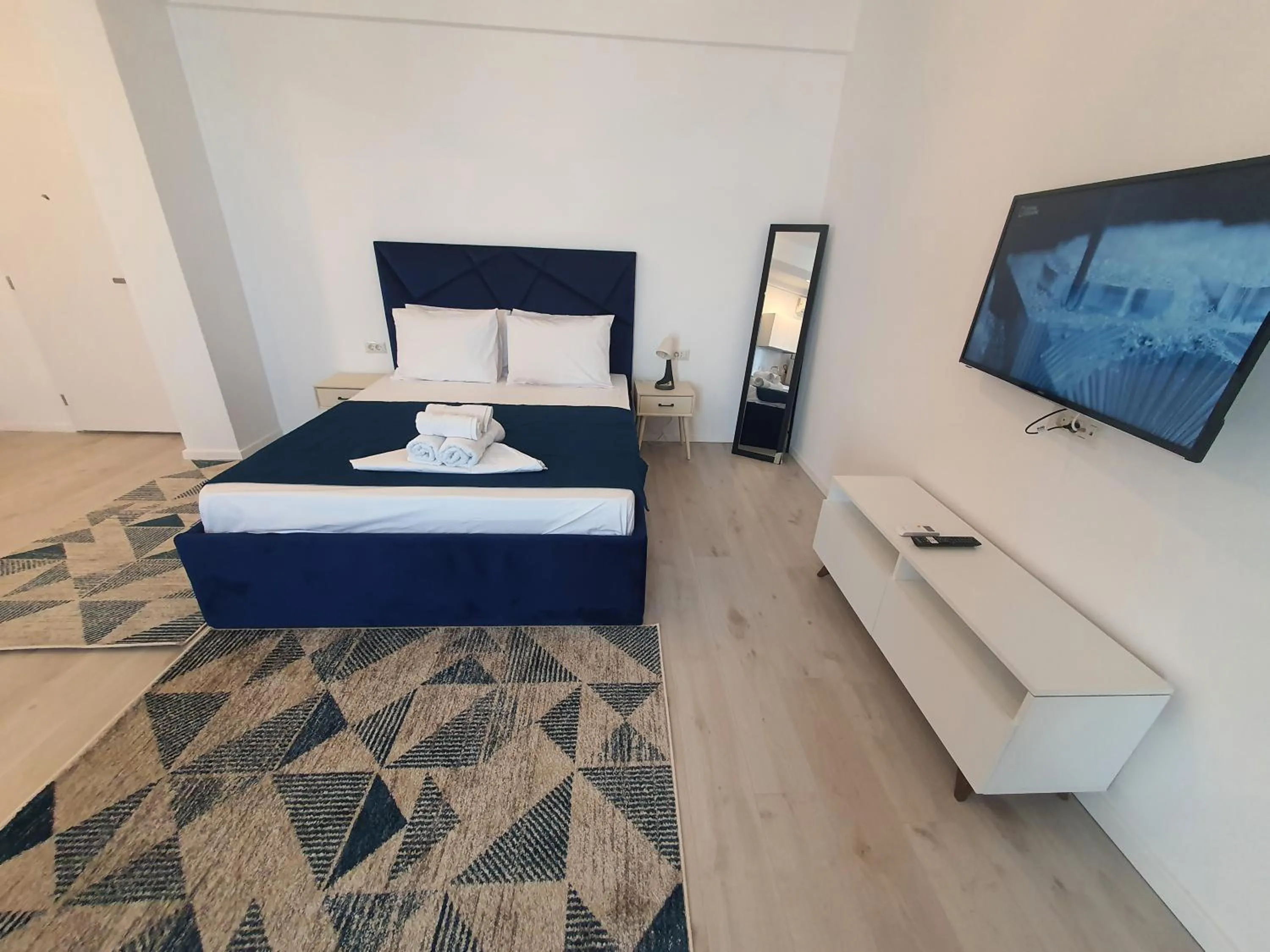 Bed in Grey Residence Apartments