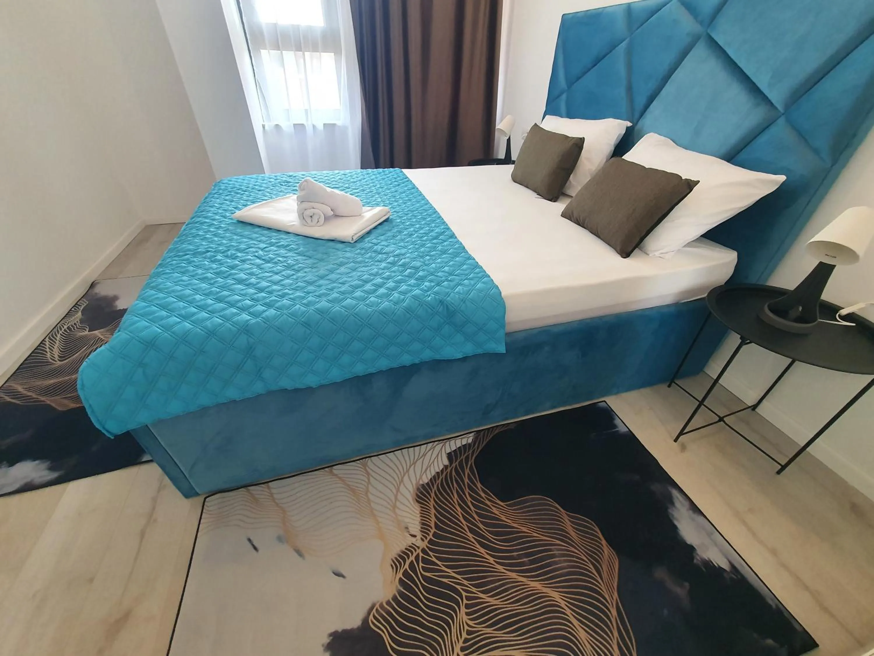 Bed in Grey Residence Apartments