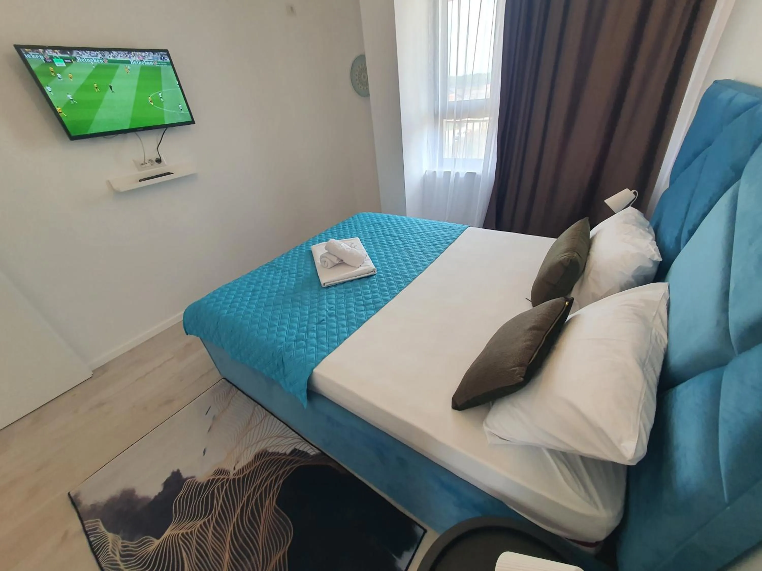 Bed in Grey Residence Apartments