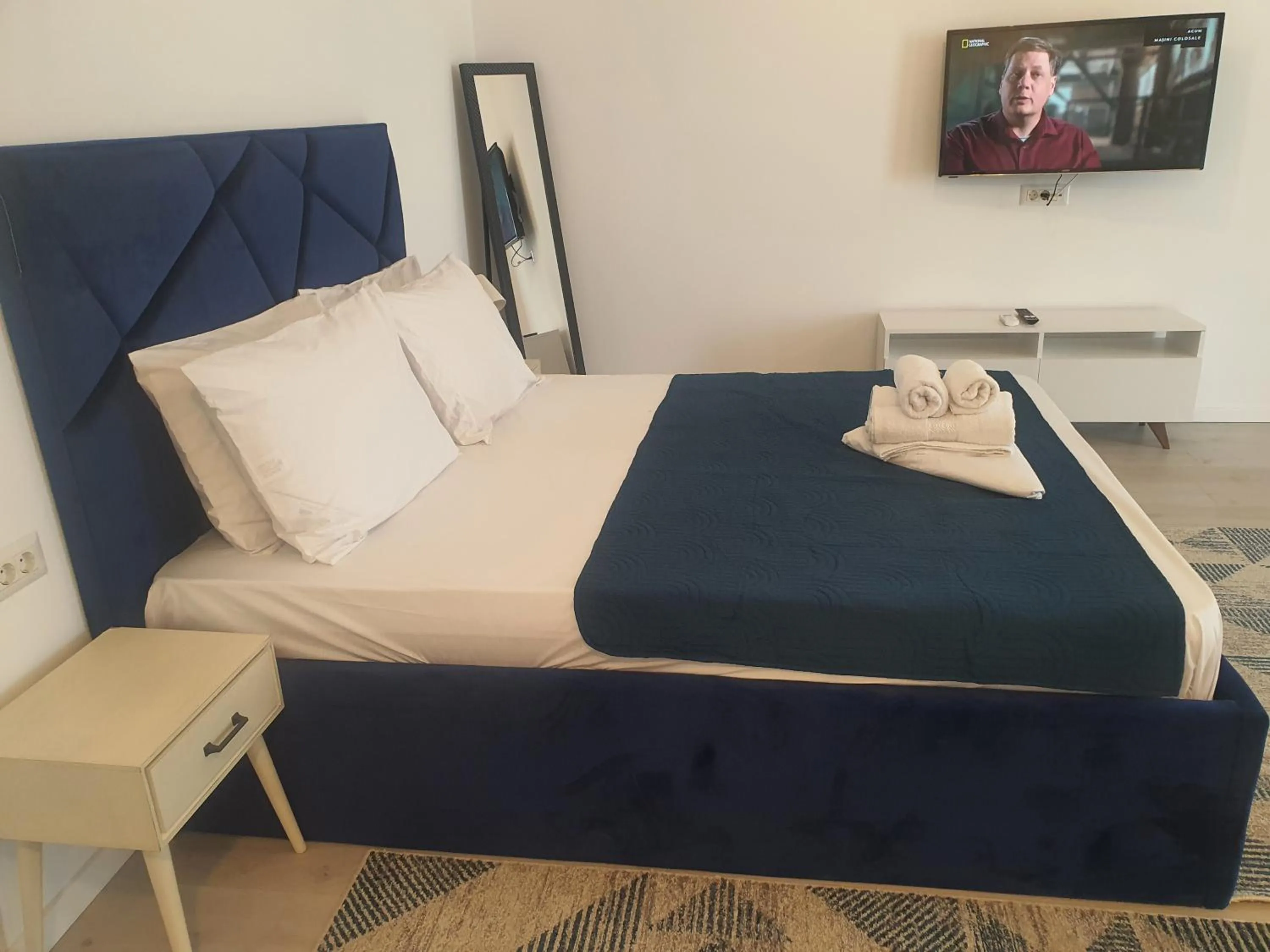 Bed in Grey Residence Apartments