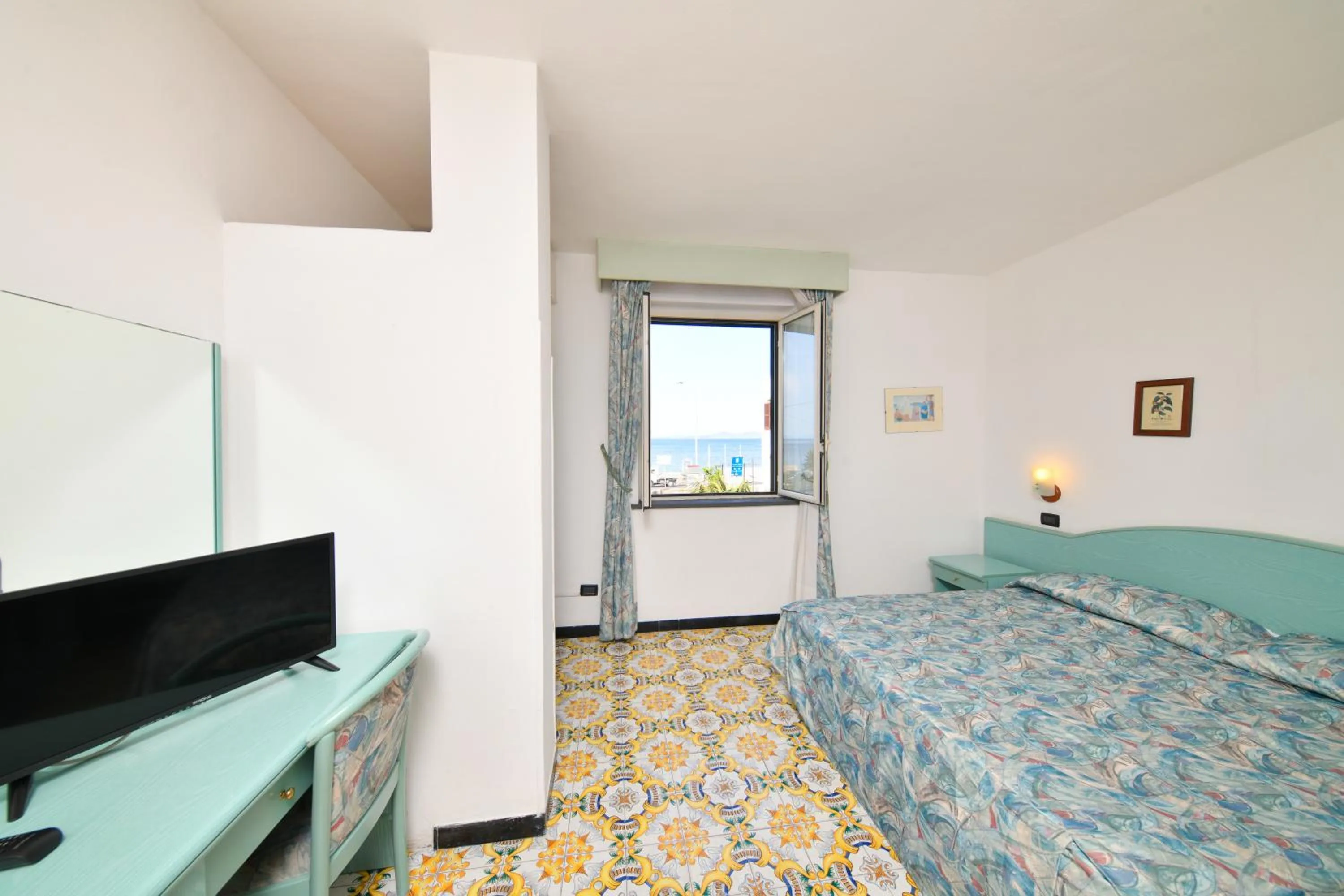 Photo of the whole room, TV/Entertainment Center in Fortuna Beach - Seaside Hotel