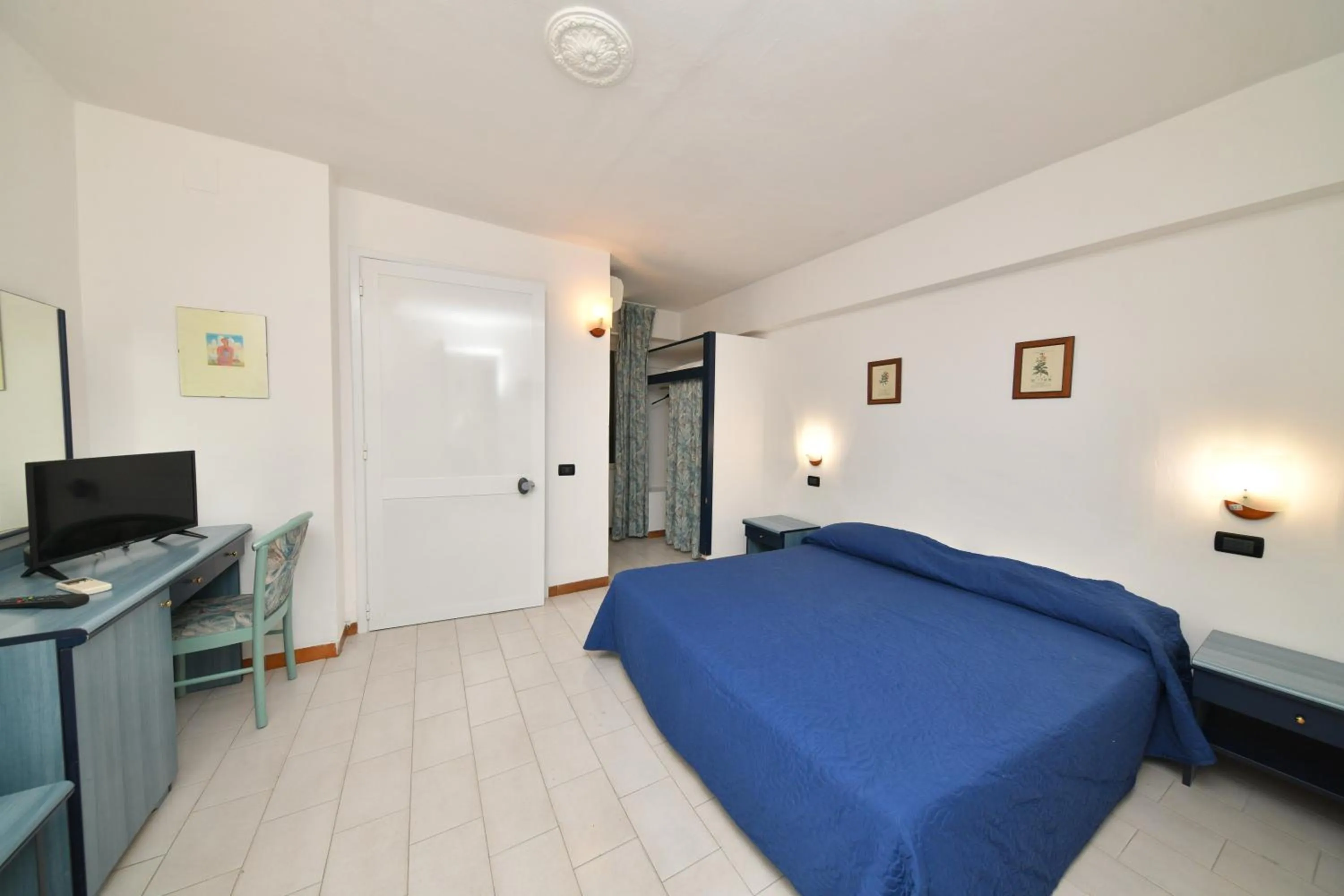 Photo of the whole room, TV/Entertainment Center in Fortuna Beach - Seaside Hotel