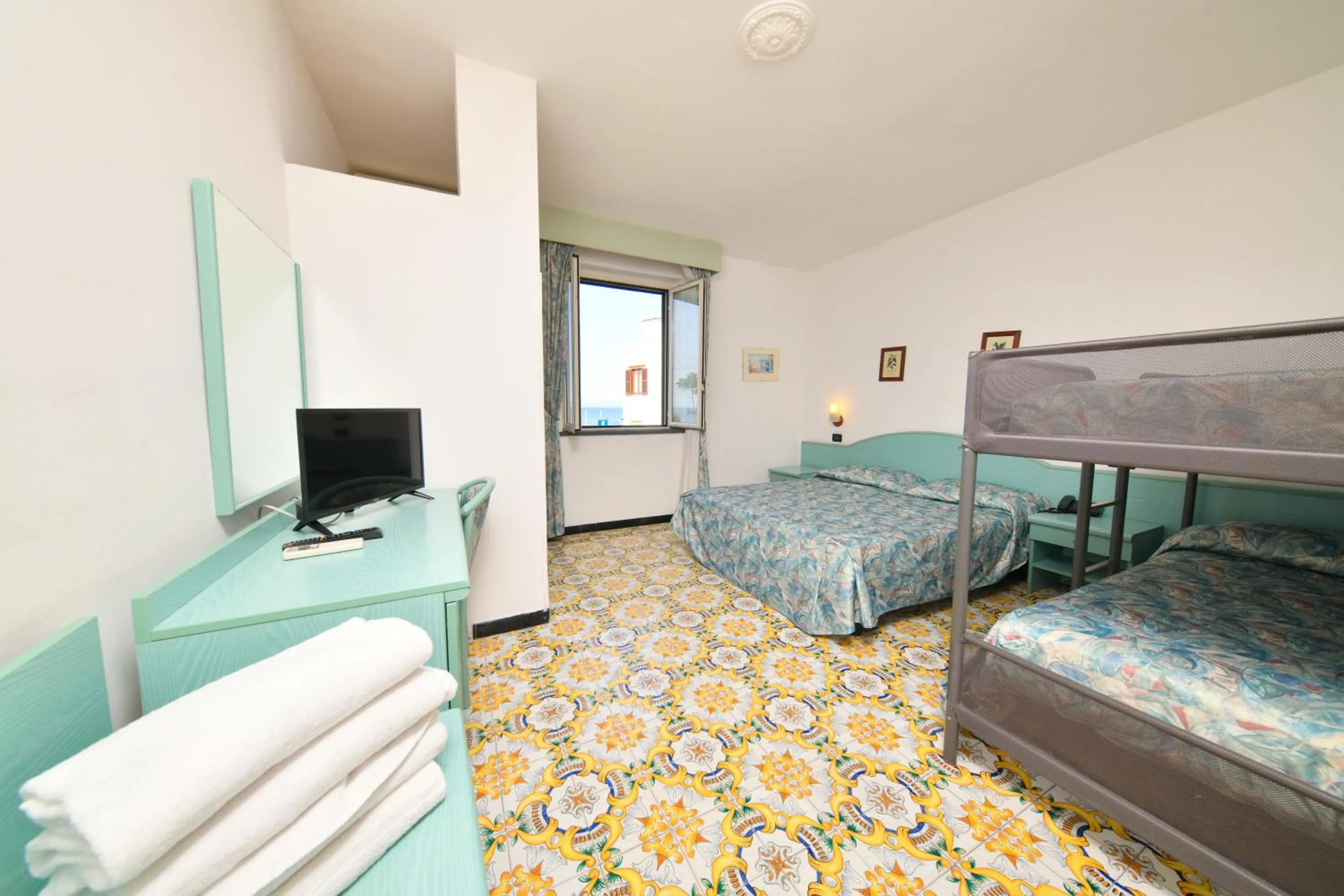 Photo of the whole room, TV/Entertainment Center in Fortuna Beach - Seaside Hotel