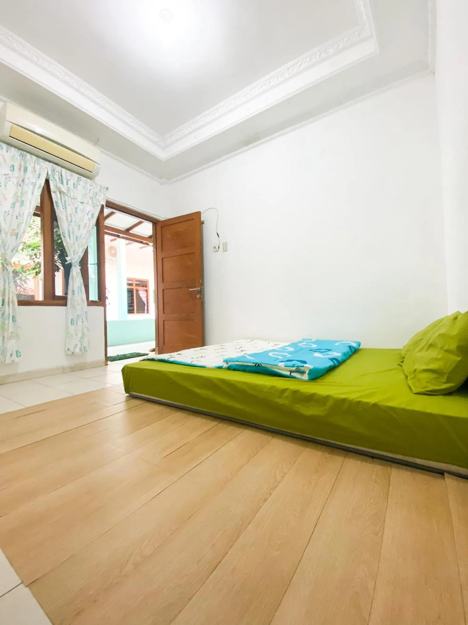 Bed in Homey Guesthouse Kertajaya (Syariah)