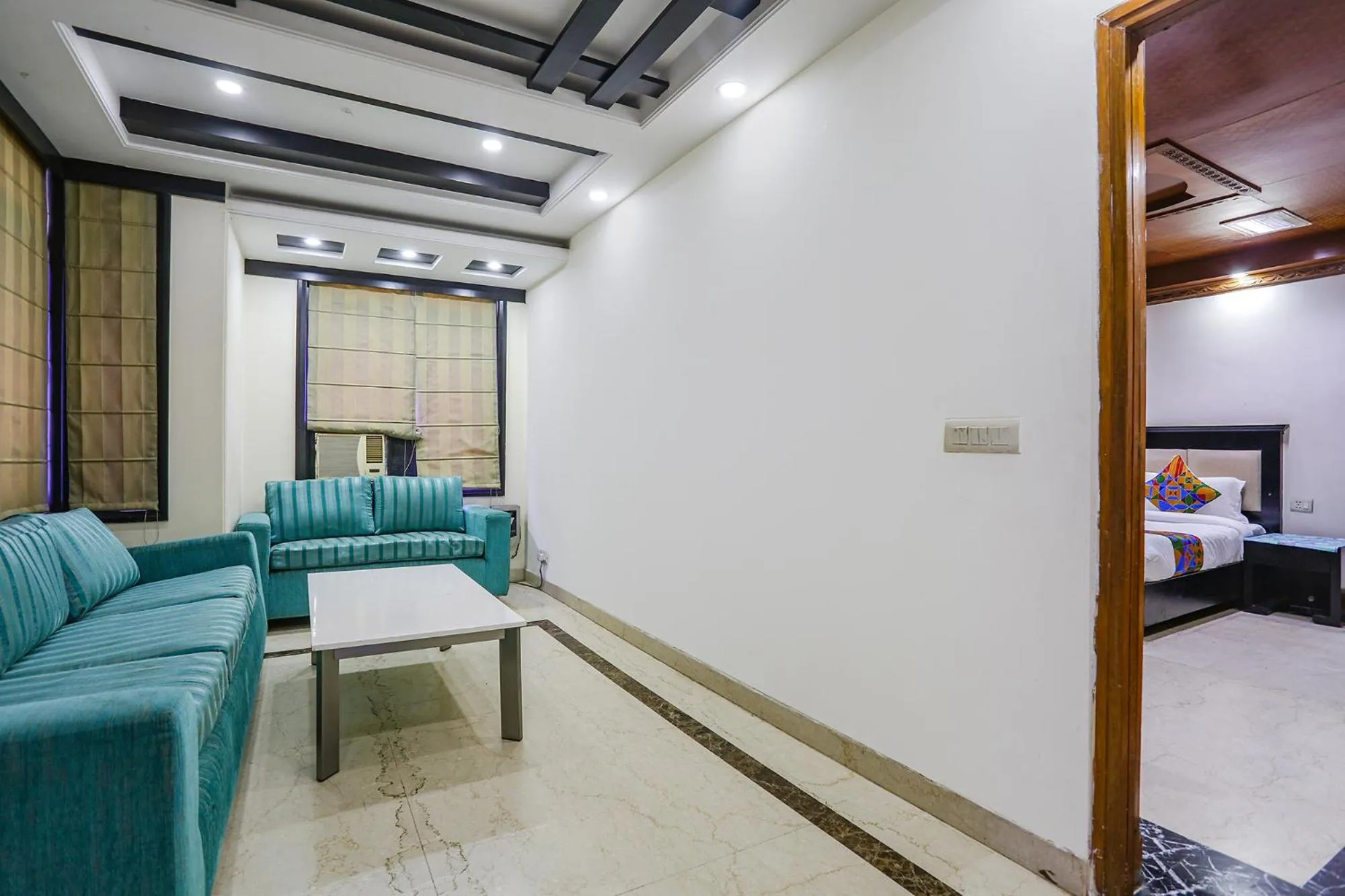 Seating area, Bed in FabHotel Blue Moon Home Stay