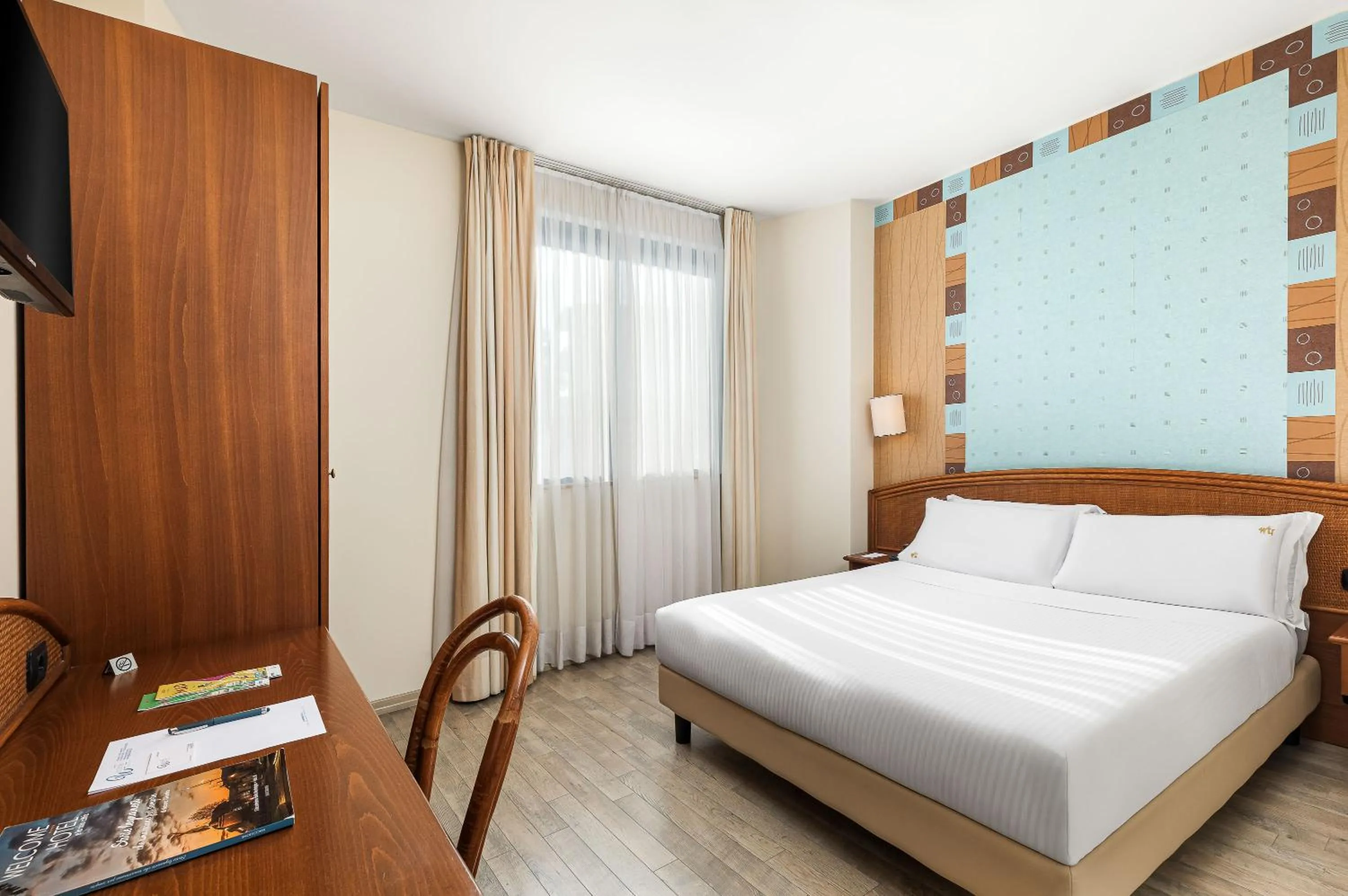 Bed in Welcome Hotel